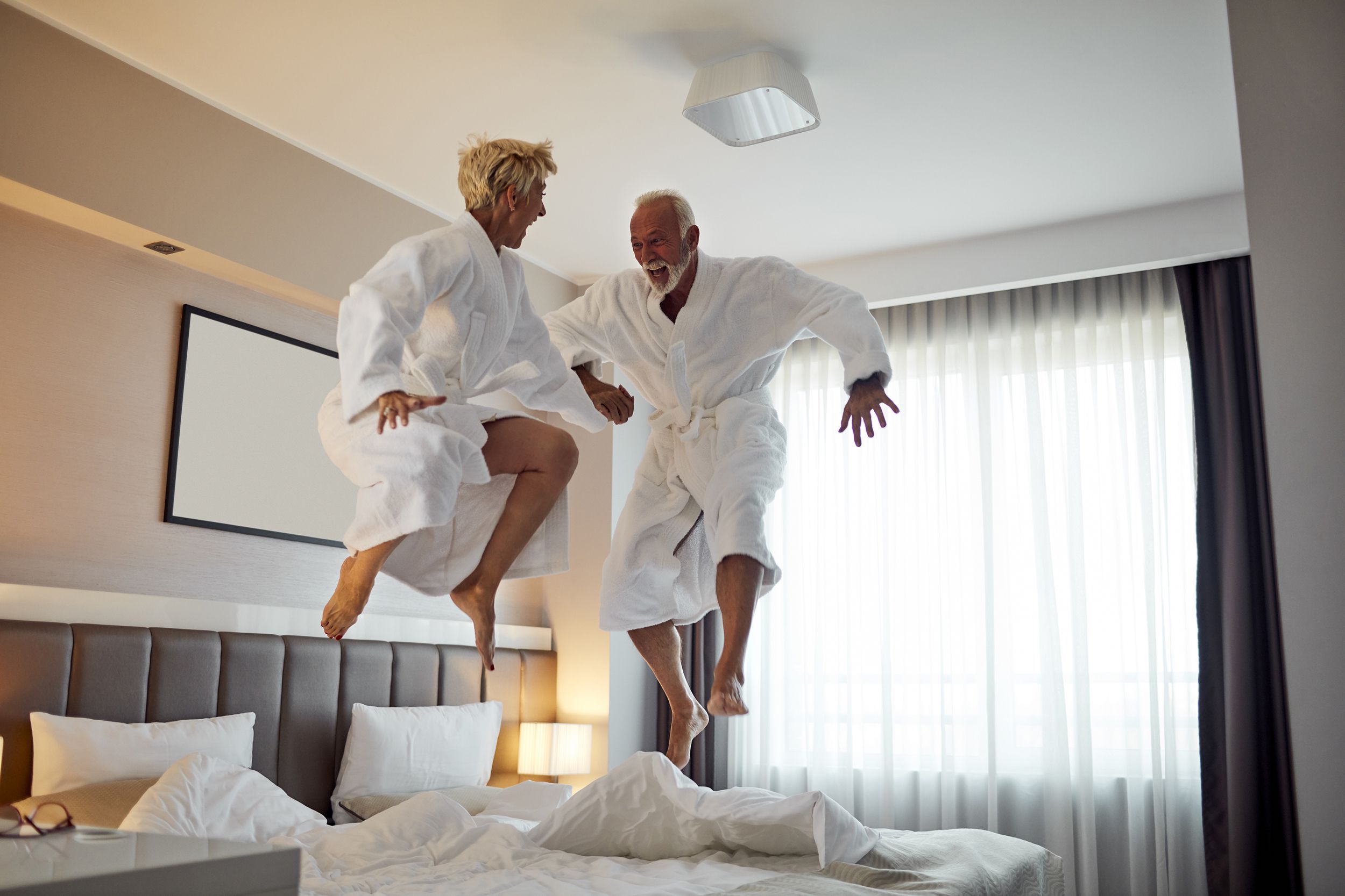 senior couple having fun in hotel room