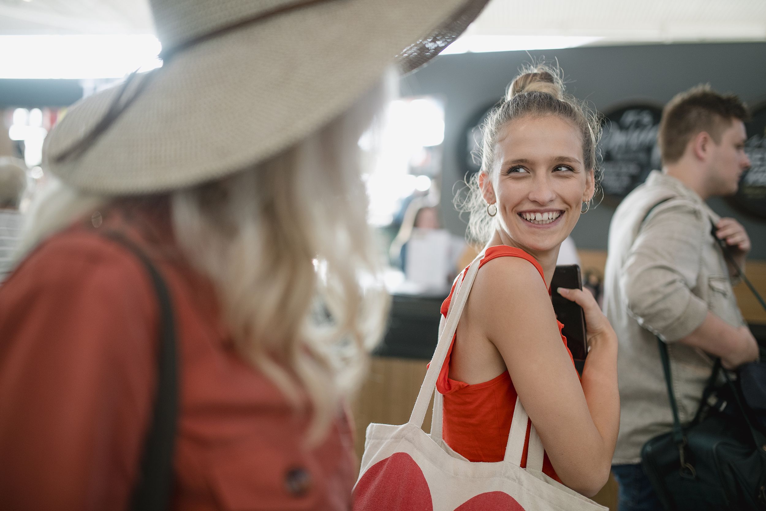 happy young woman boarding plane