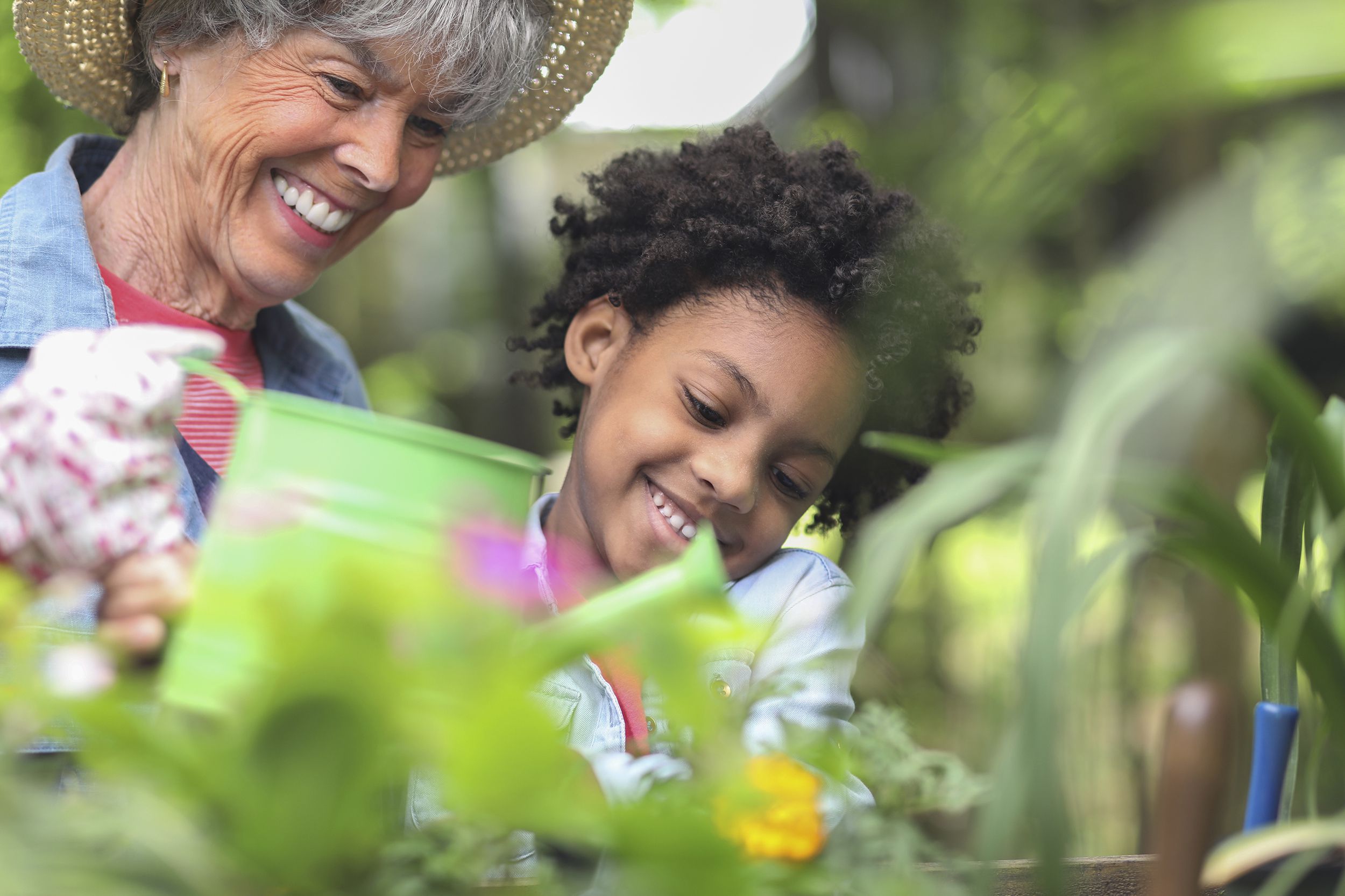 grandmother and child gardening outdoors in spring