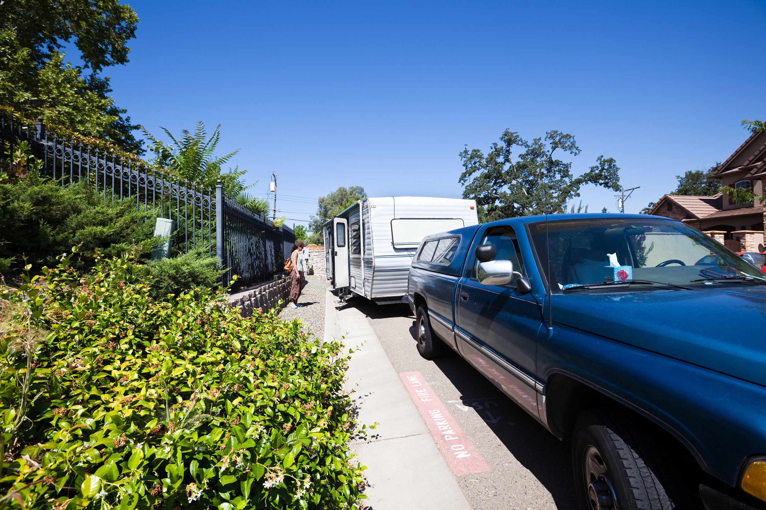 RV and truck parked in residential area