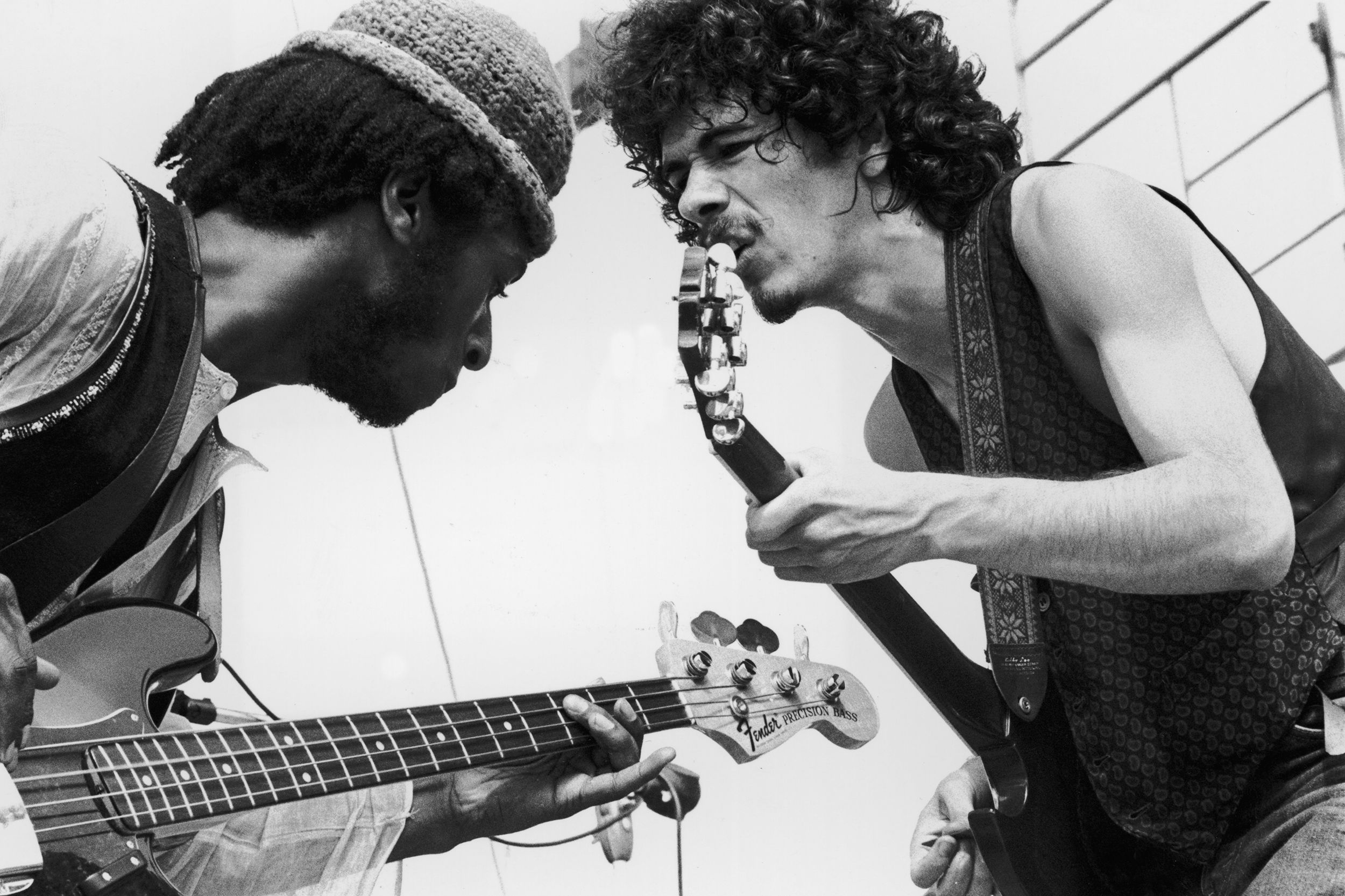 Mexican-born guitarist Carlos Santana (right) and bassist David Brown perform with the group Santana at the Woodstock Music Festival