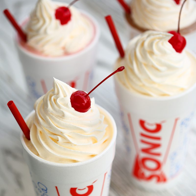 sonic milkshakes with whipped cream and cherry on top