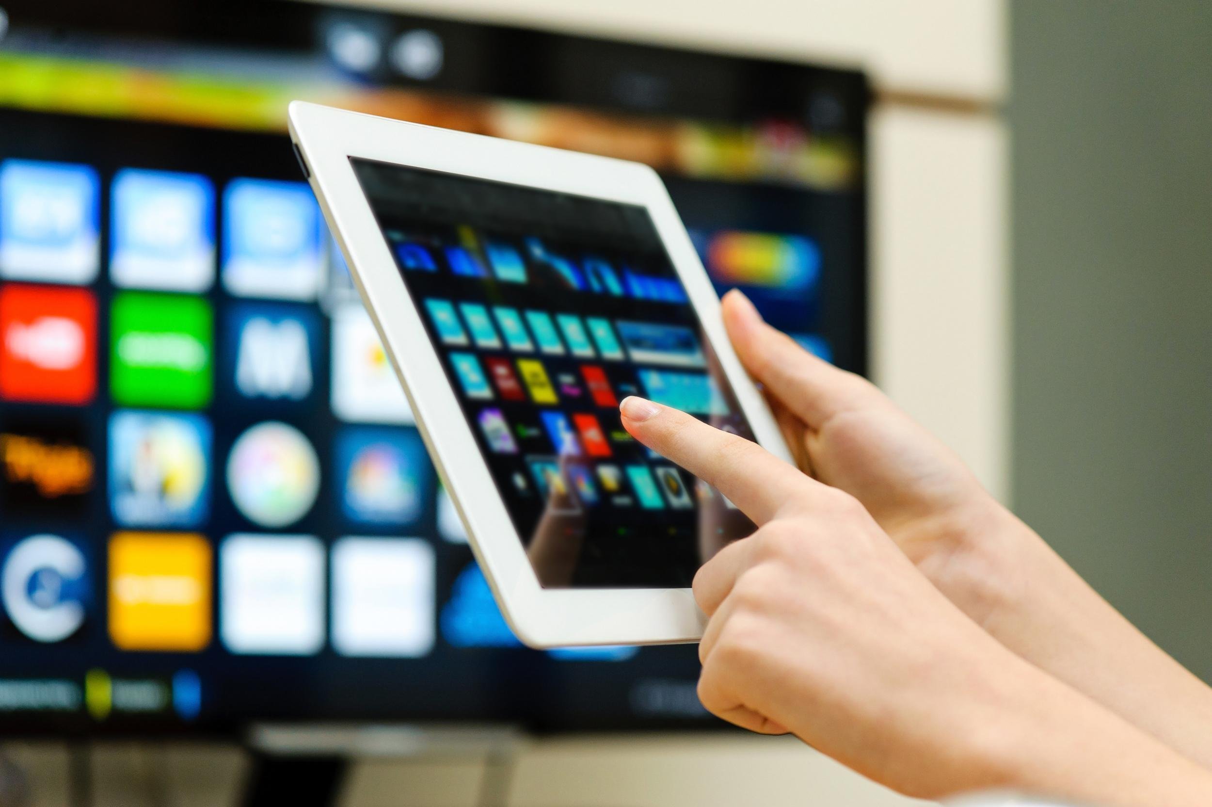hands with tablet watching roku