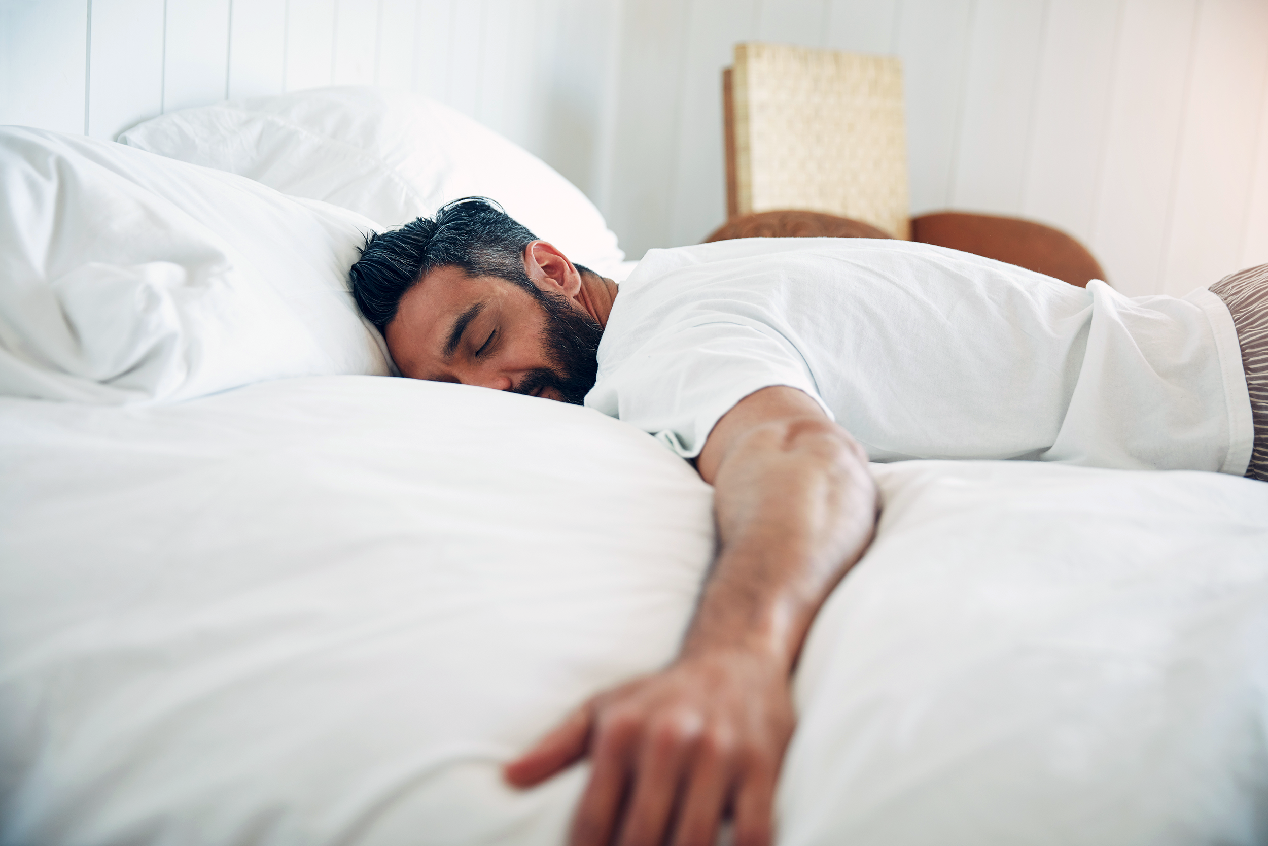 Man lying in a comfortable bed