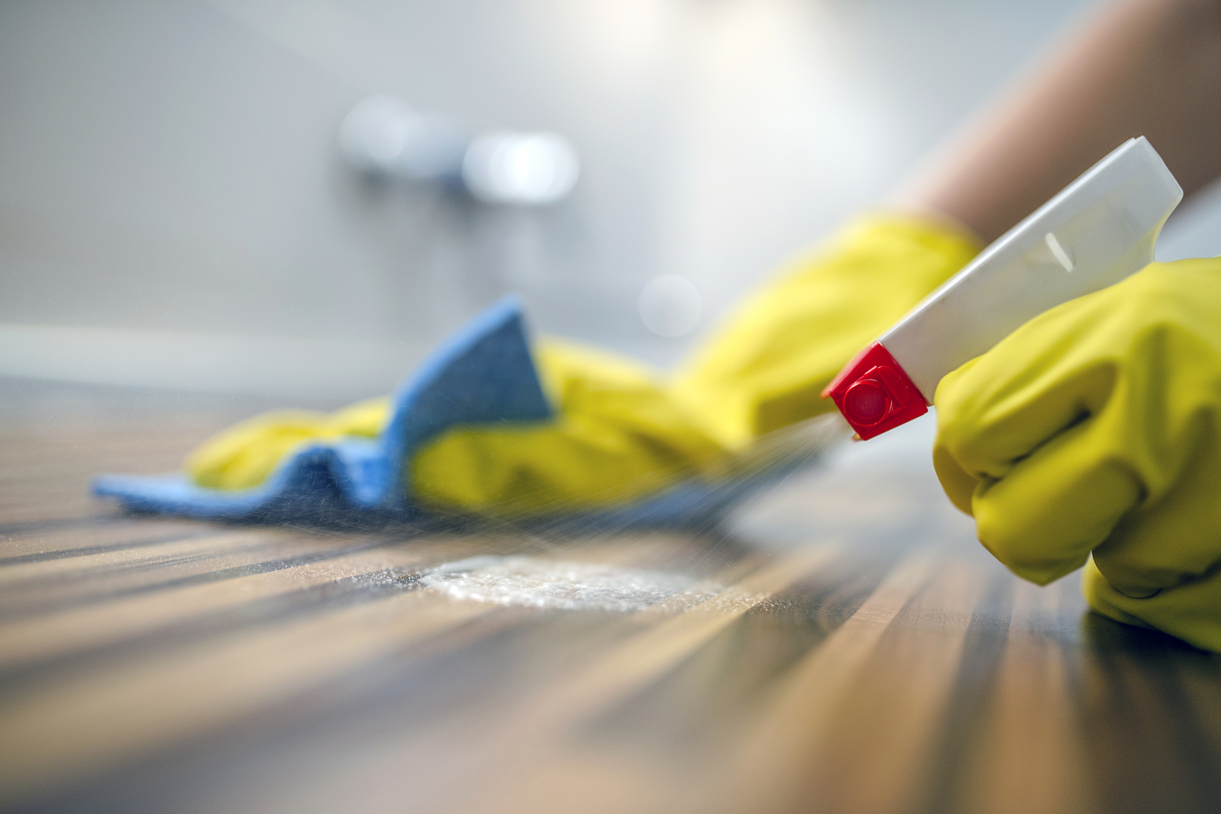 Cleaning the counter with spray