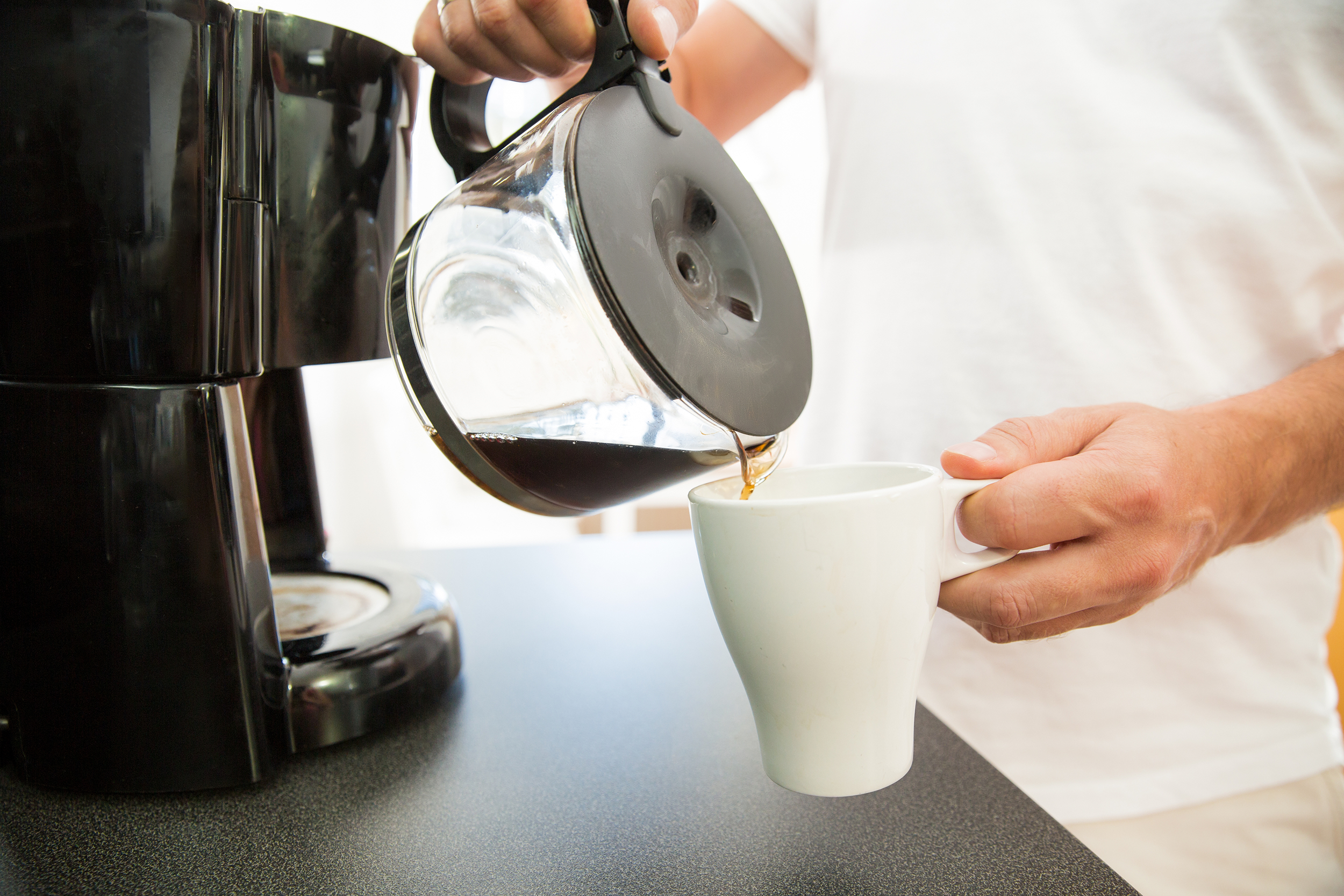 Man pouring a cup of coffee
