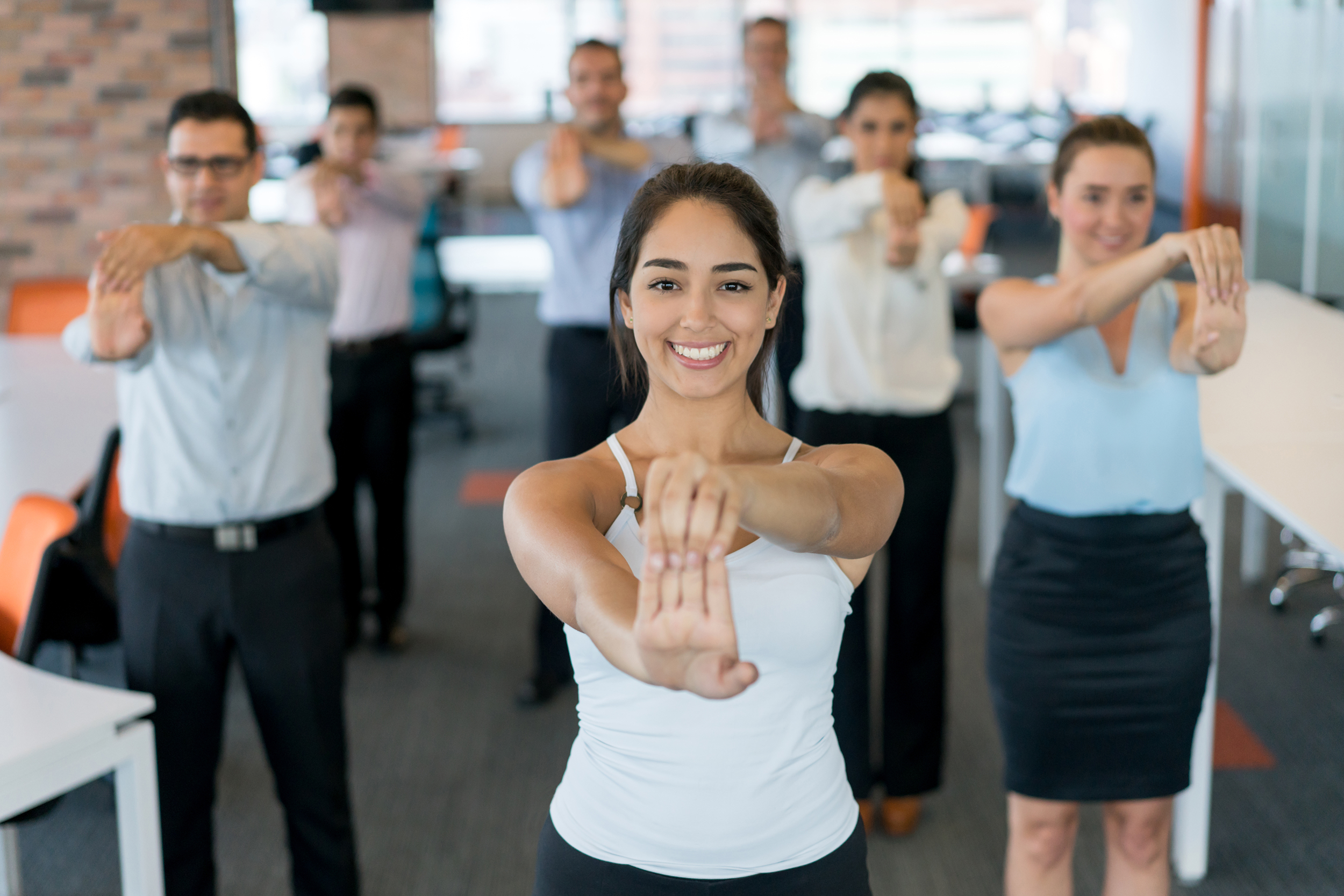 Office workers taking a stretch break