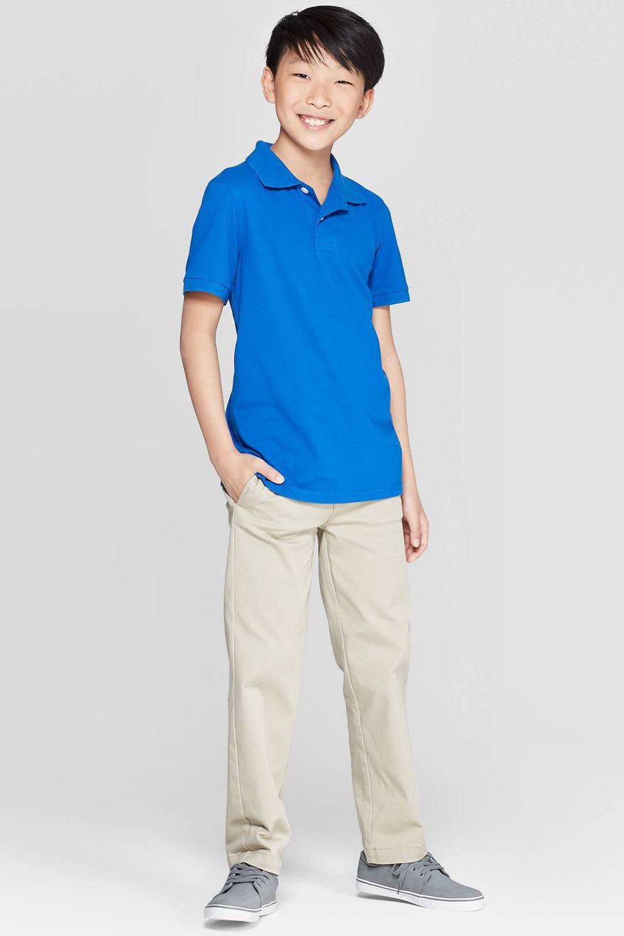 boy in uniform polo shirts and chino pants