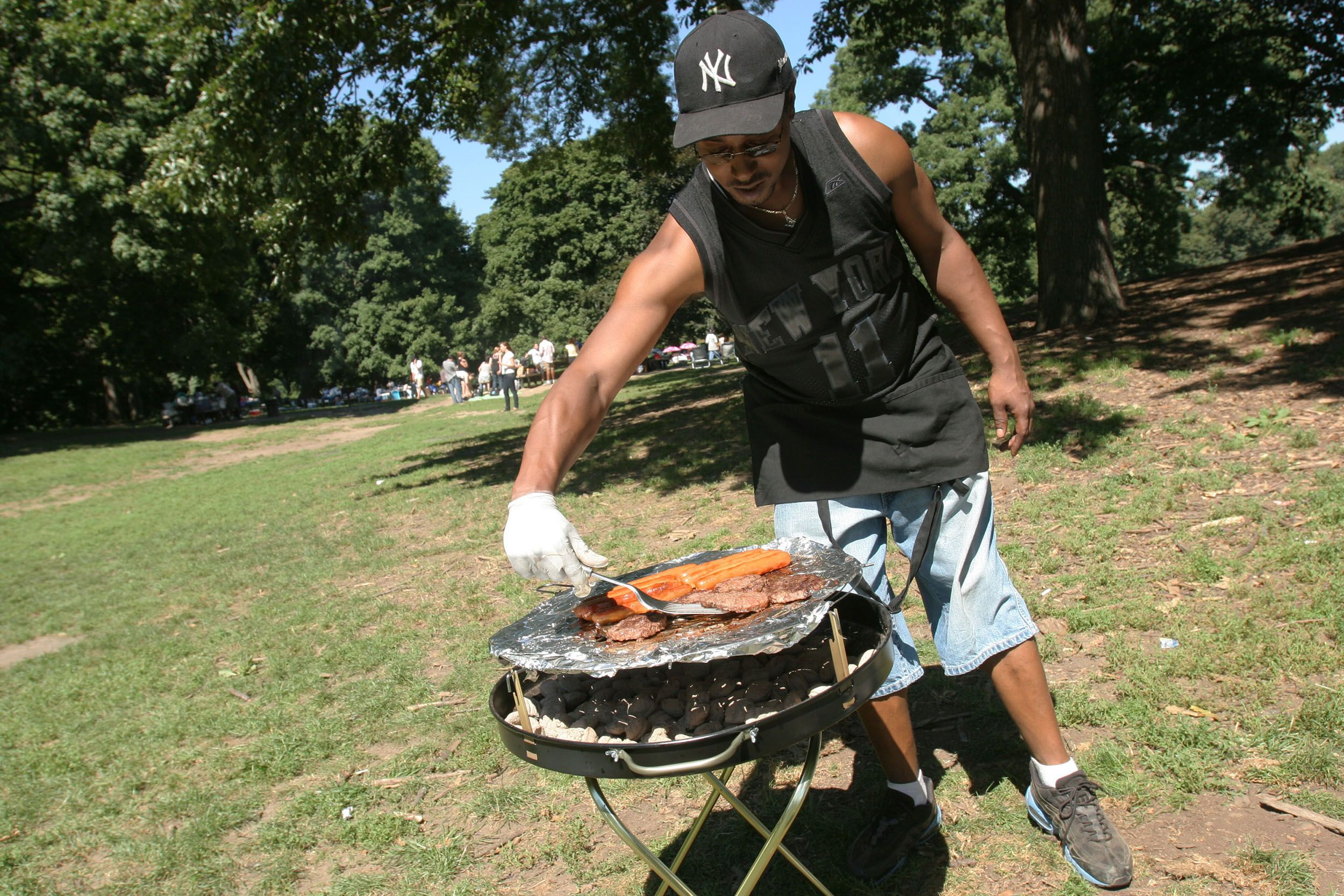 man grilling in prospect park