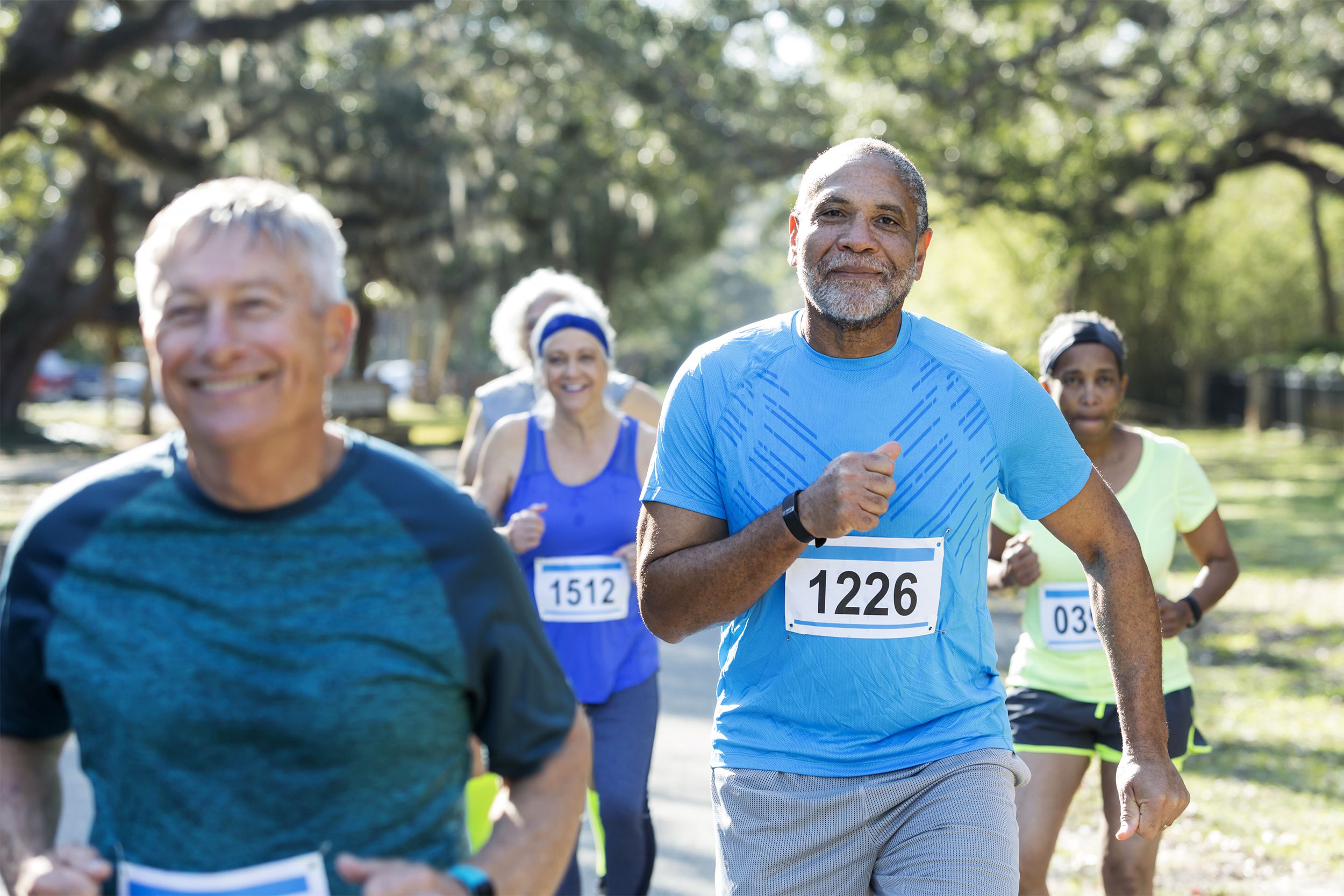 Group of multi-ethnic seniors running a race