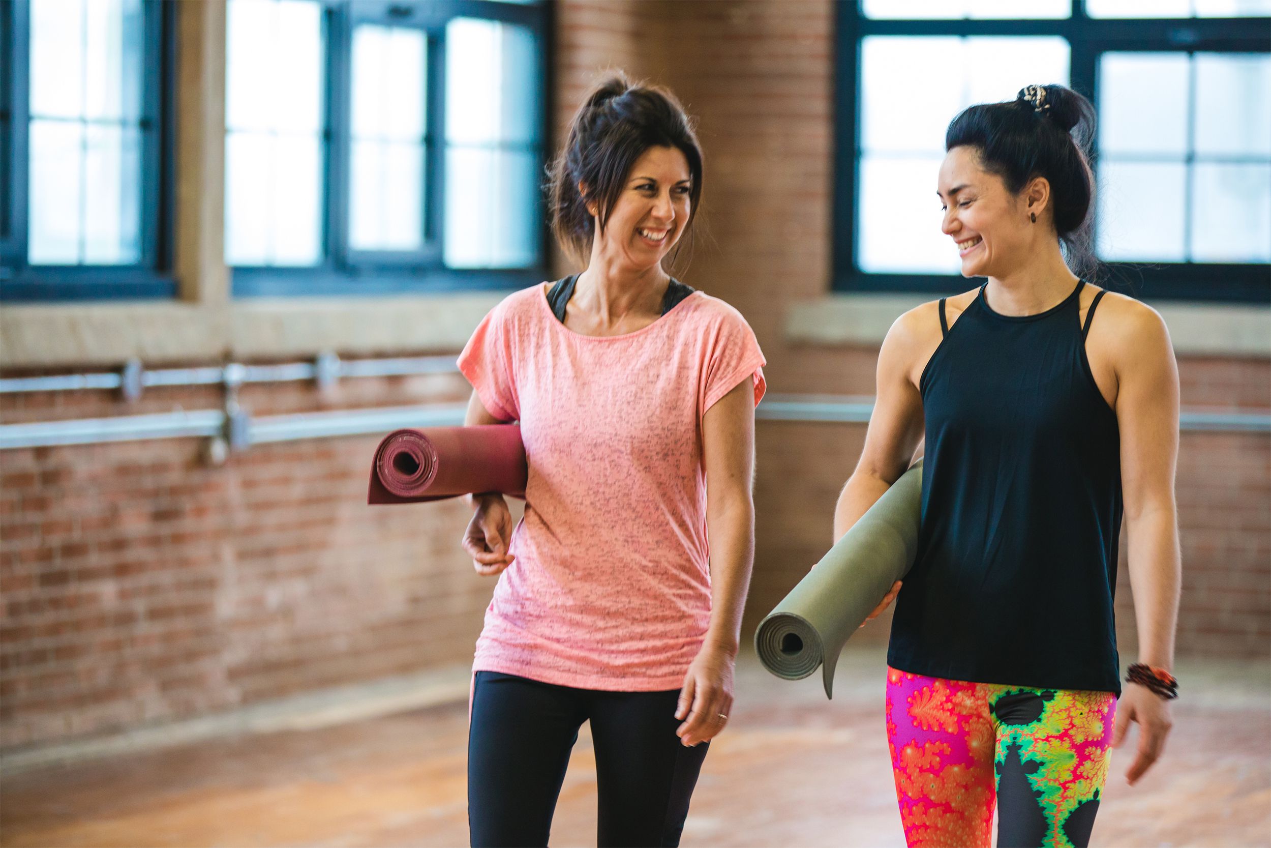 Women talking together before a yoga class