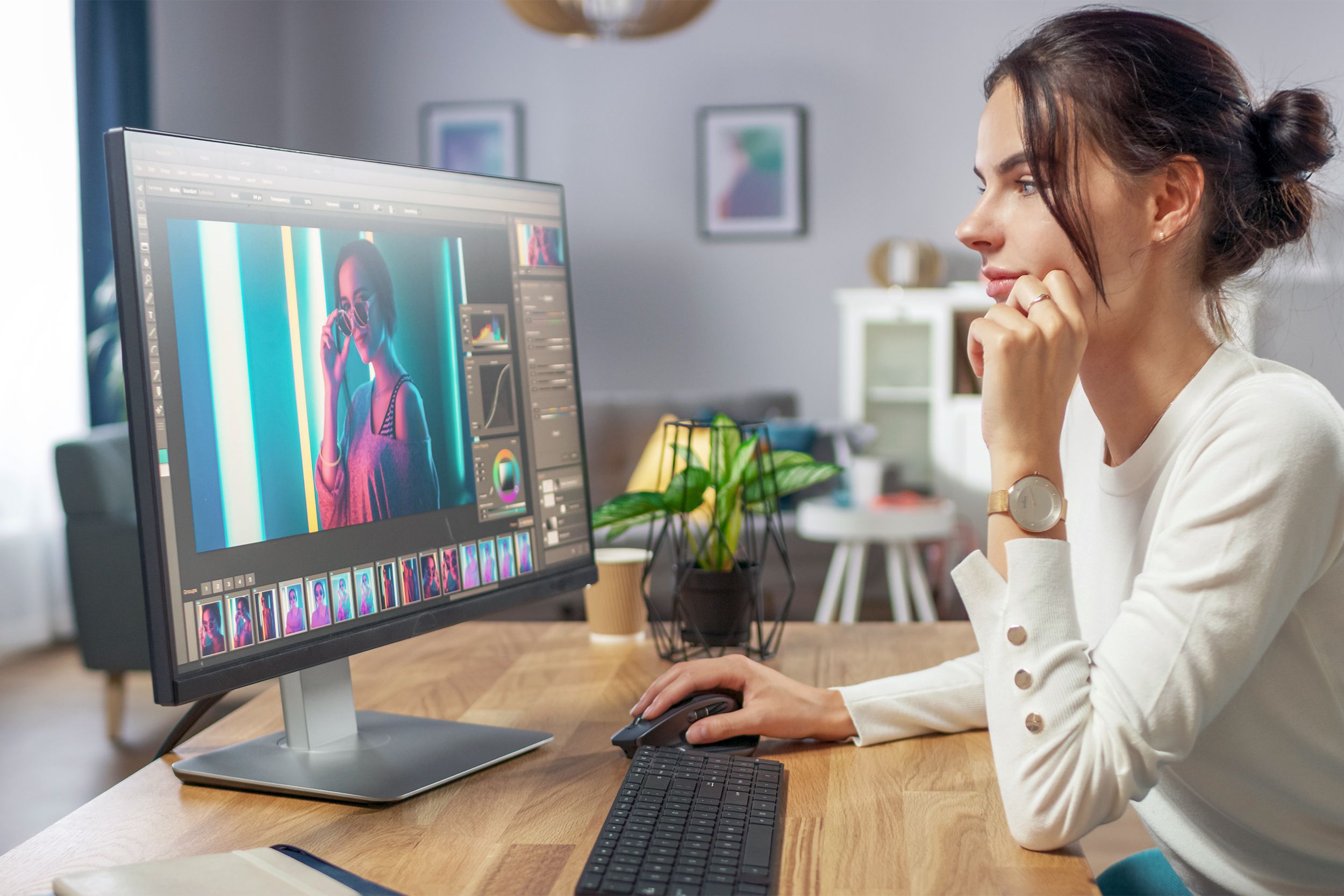 Woman editing photos on her computer