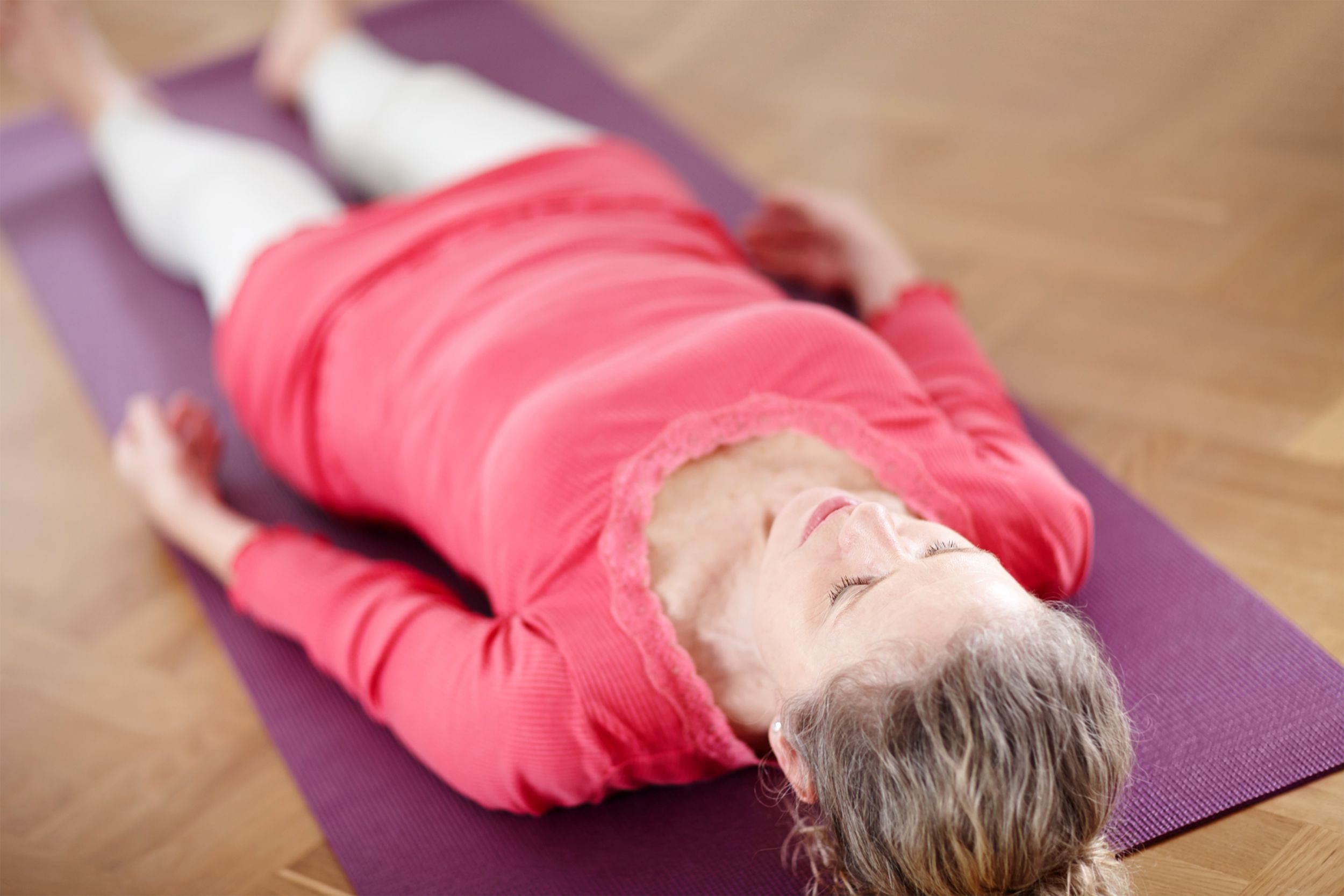 Senior woman lying on floor