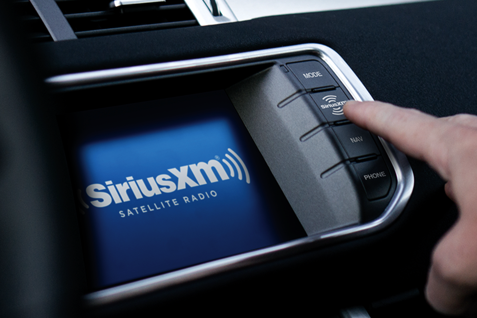 siriusxm radio, finger pressing screen in vehicle