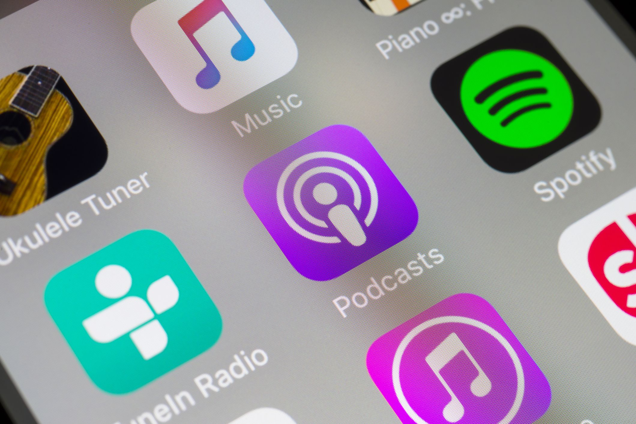 apps on phone screen with podcast app