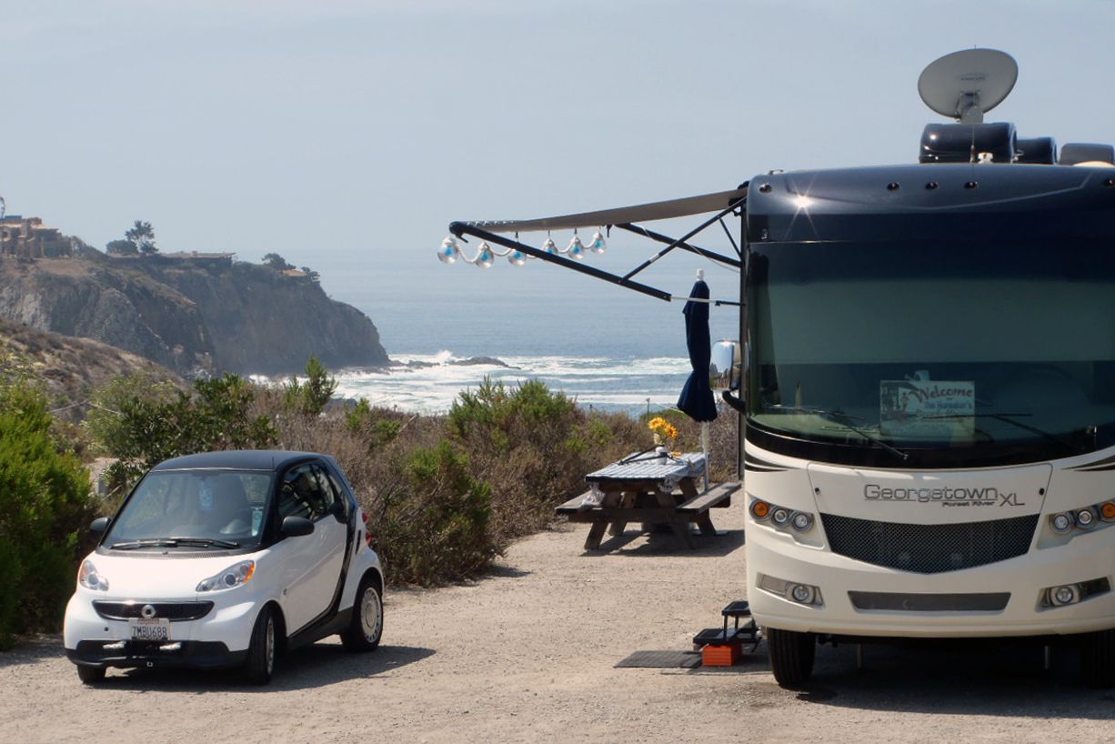 crystal cove state park camping area, rv in foreground, ocean cliffs in background