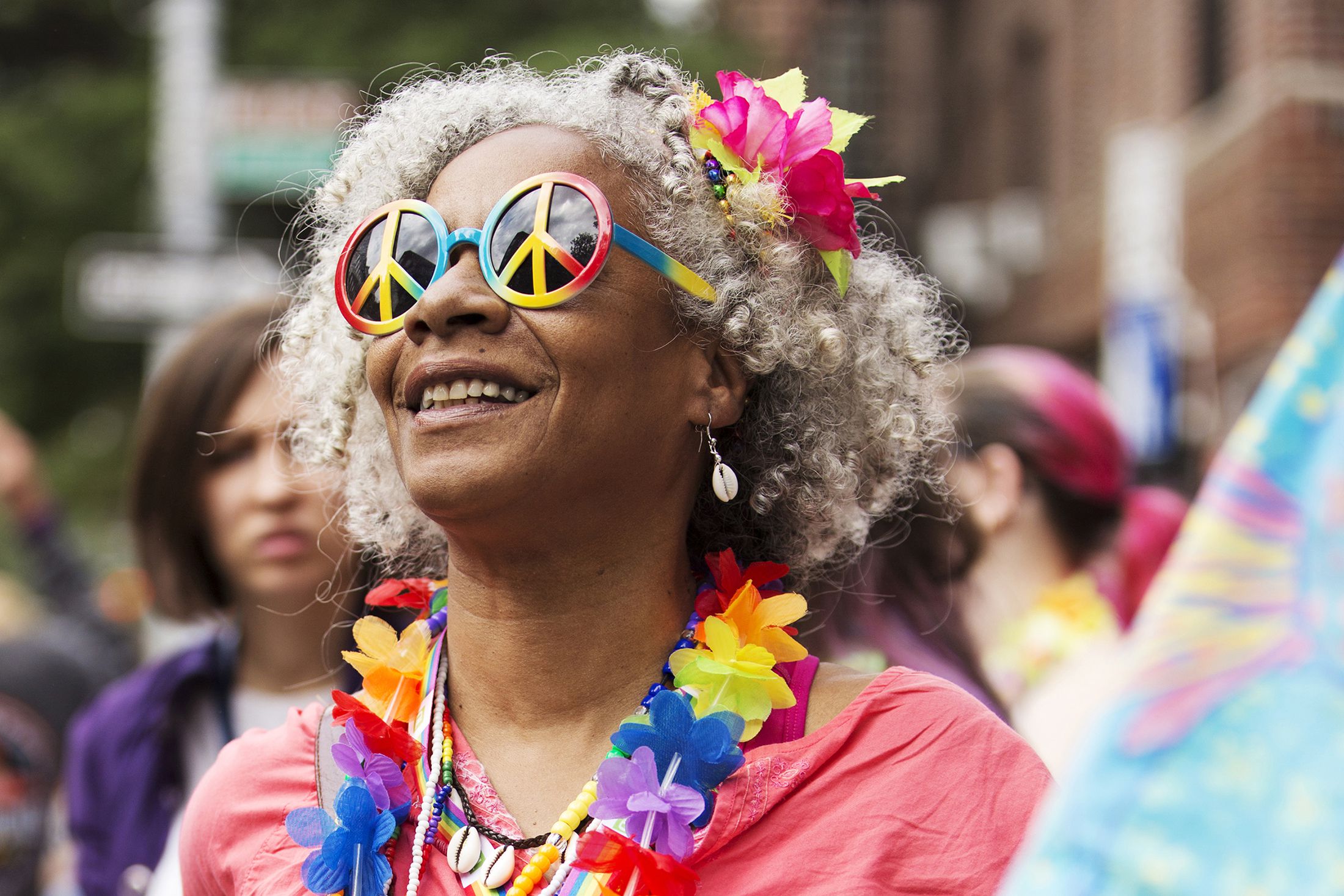 smiling woman with colourful parade gear