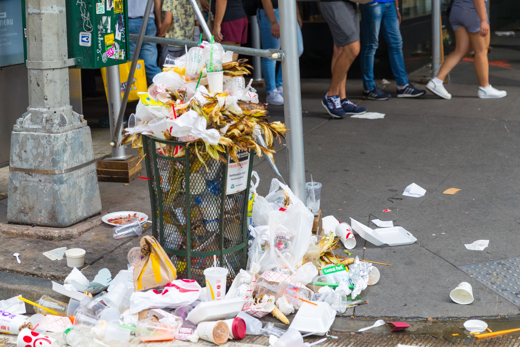 overflowing trash bin with food in new york