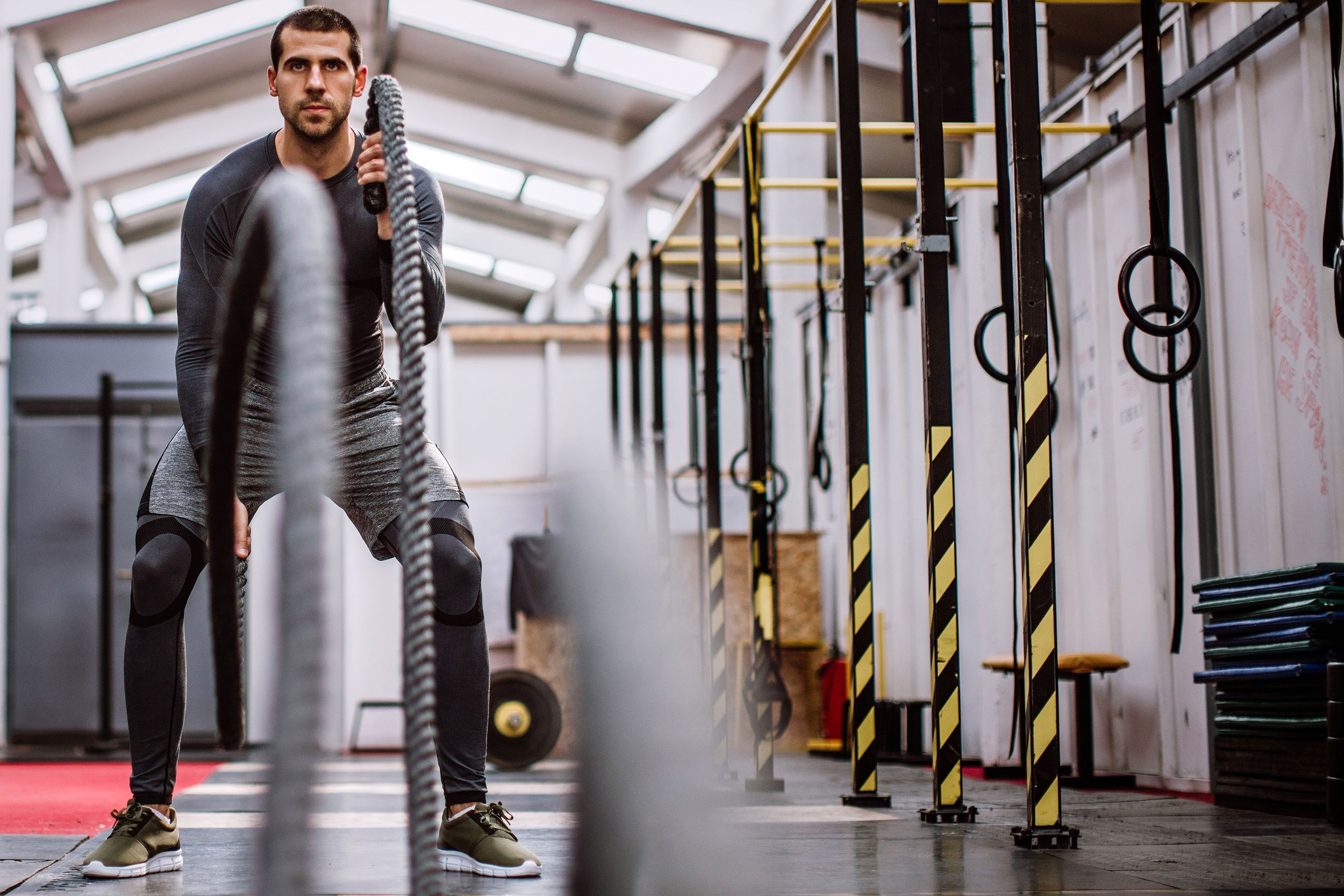 Man using ropes at a gym