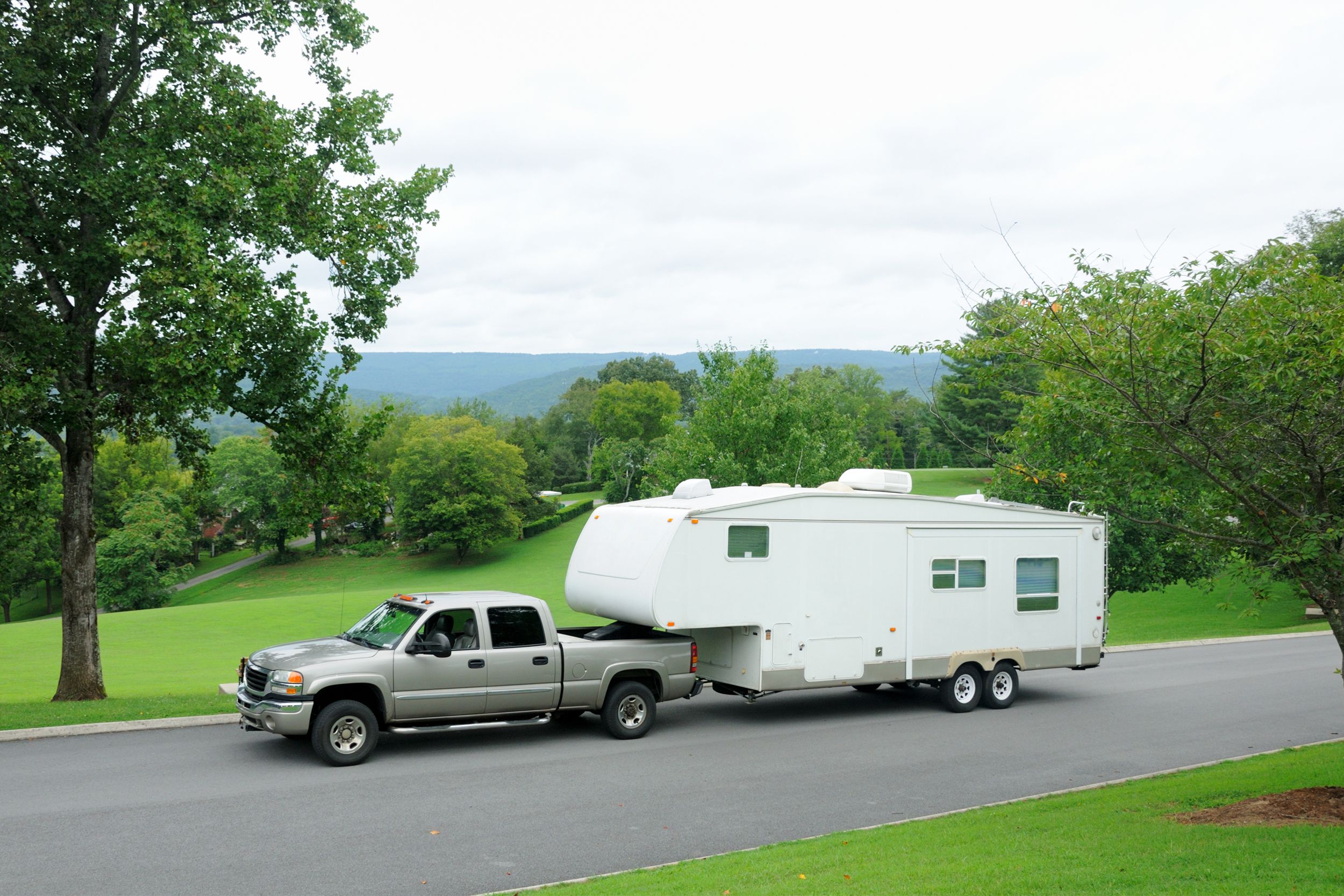 Truck towing a fifth wheel camper