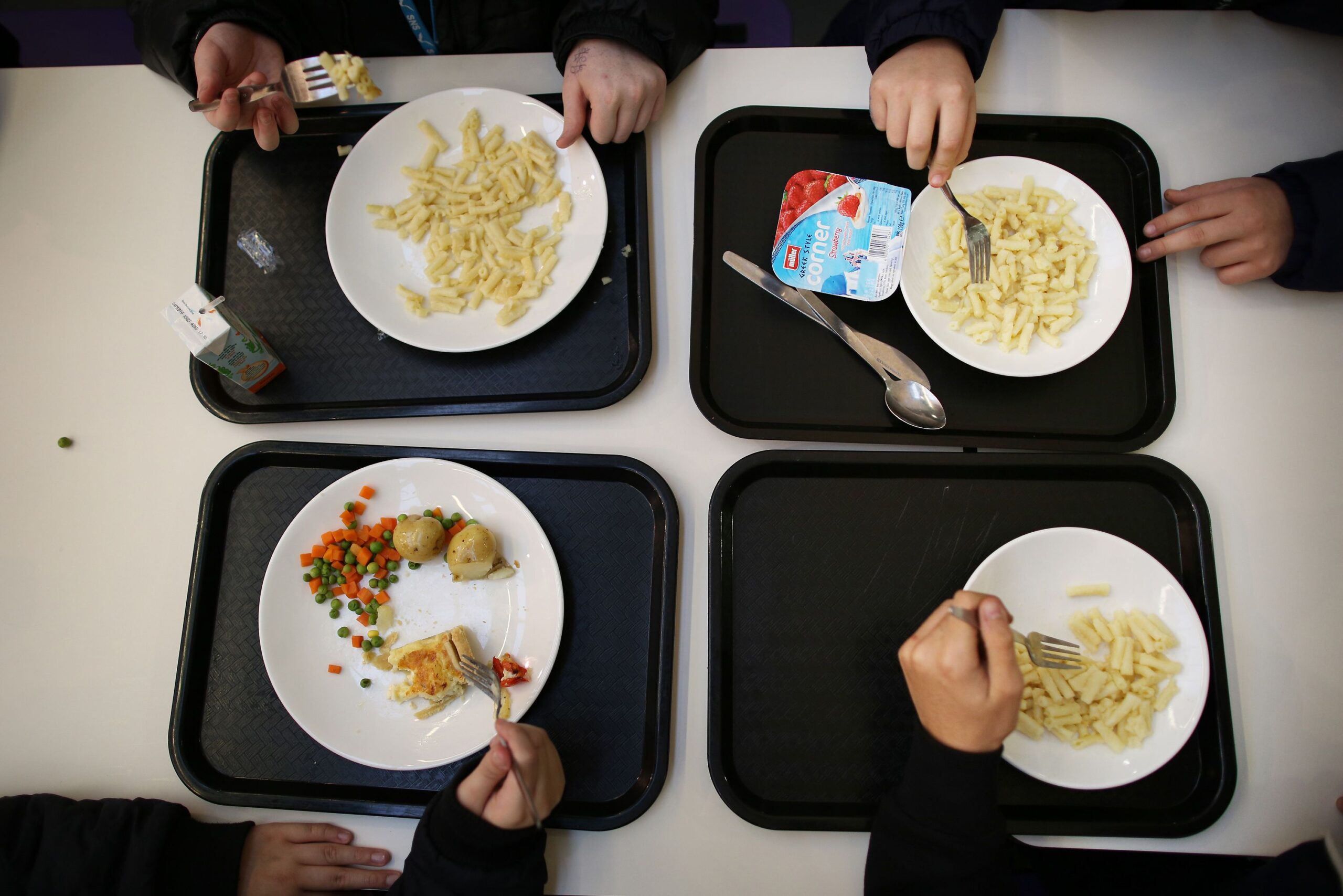 students eat their lunch in the canteen at a secondary school on december 1, 2014 in london, england