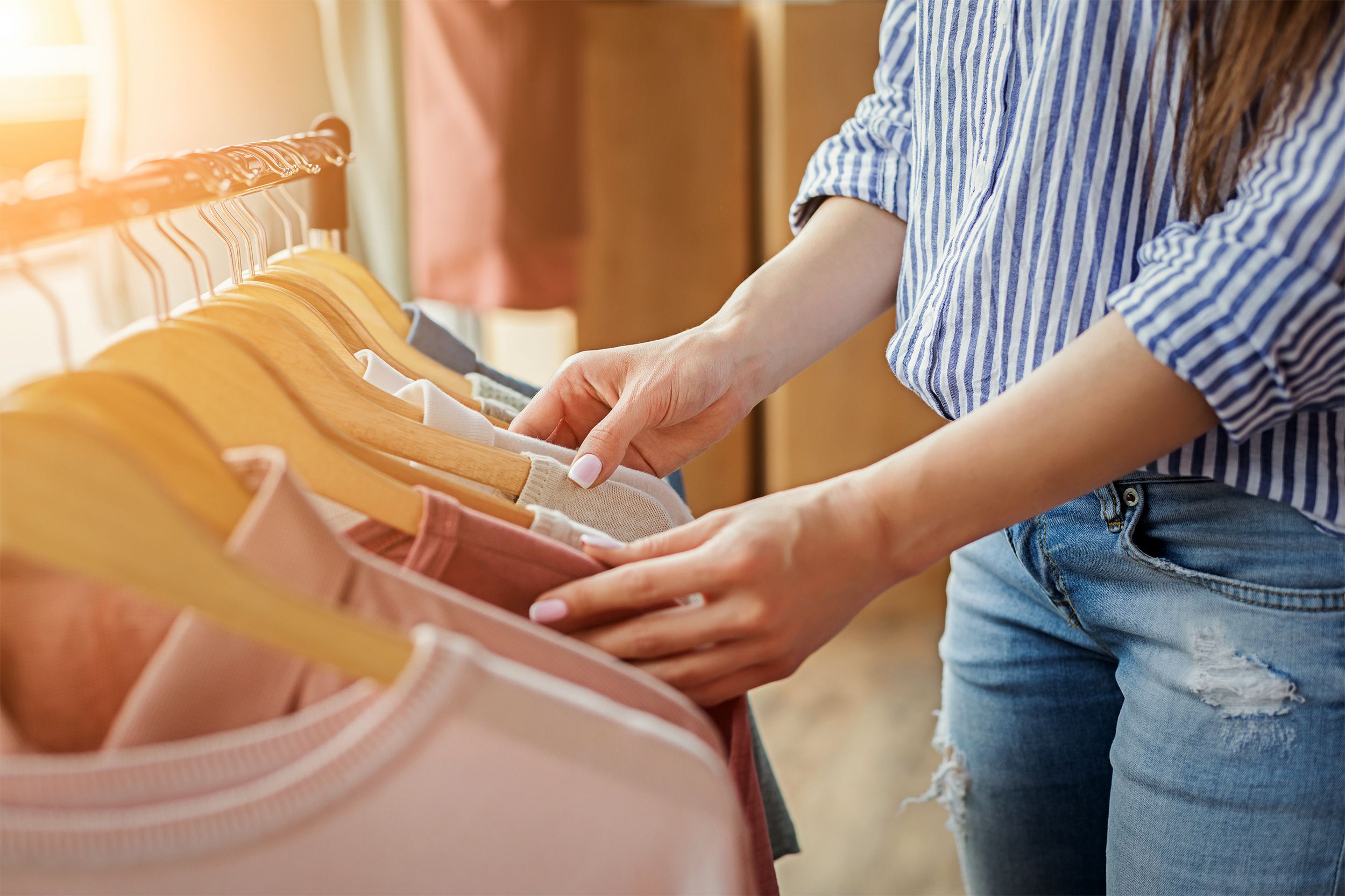 Woman selecting clothes on a rack