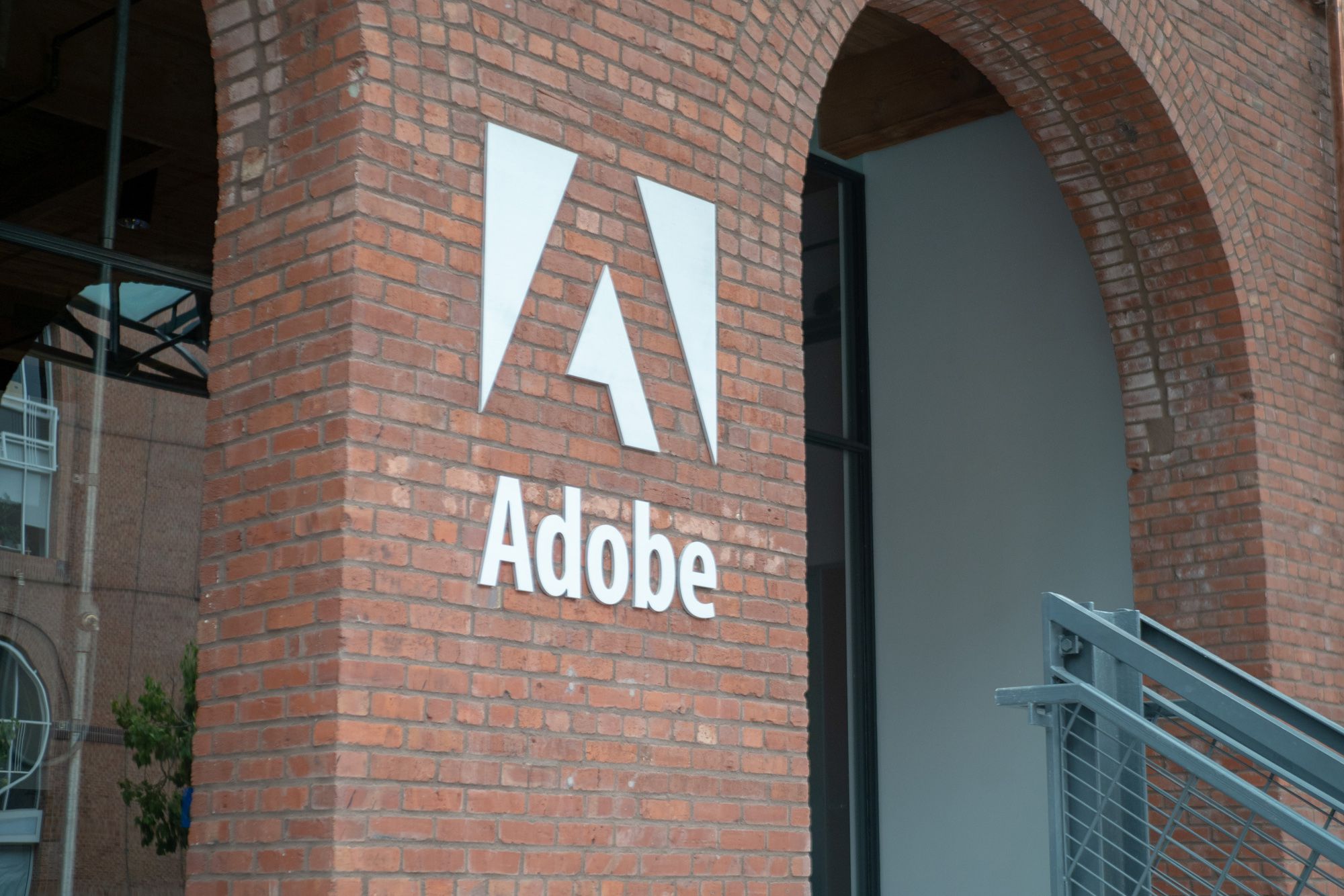 brick office building in san francisco with adobe logo