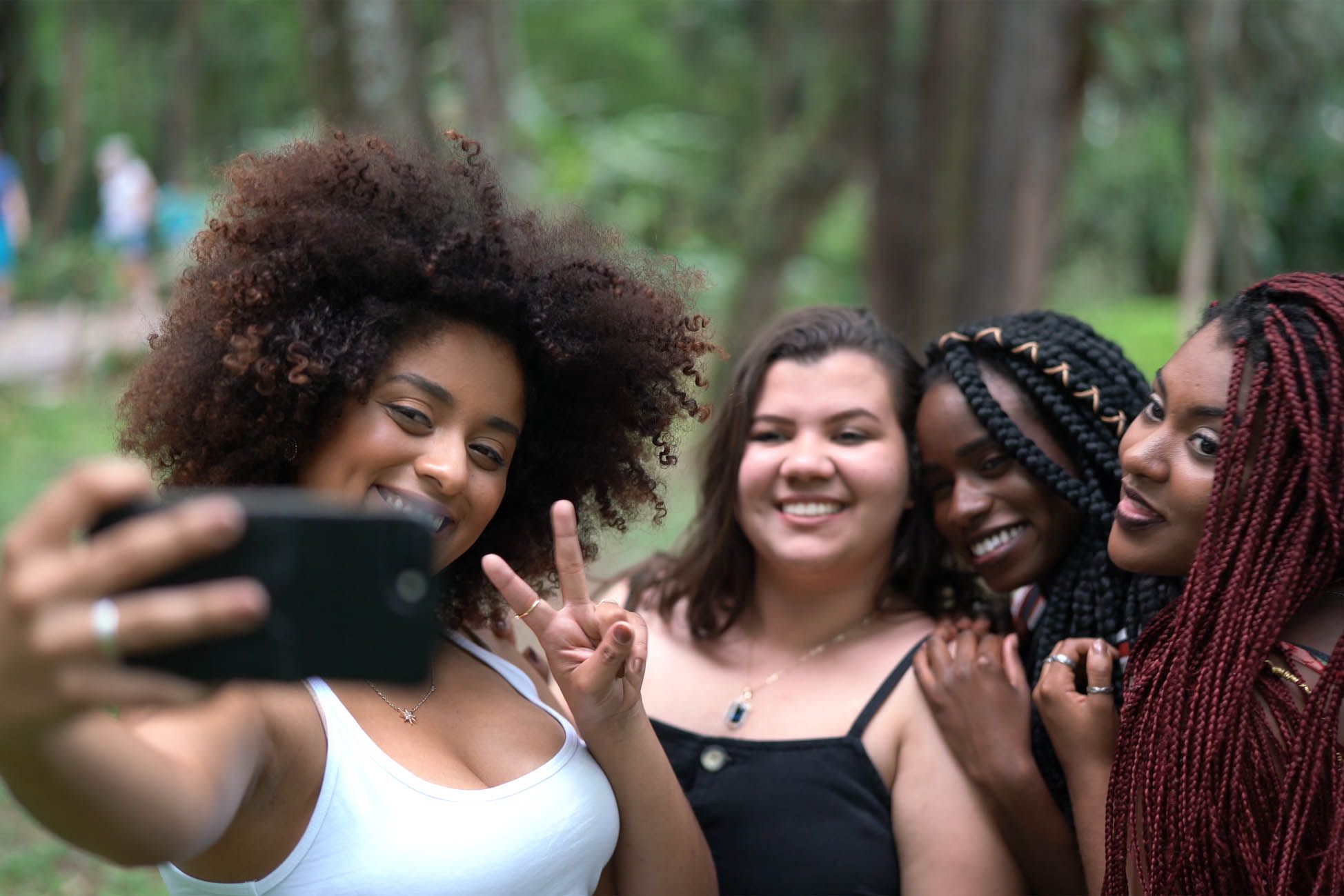 group of young women taking selfie together