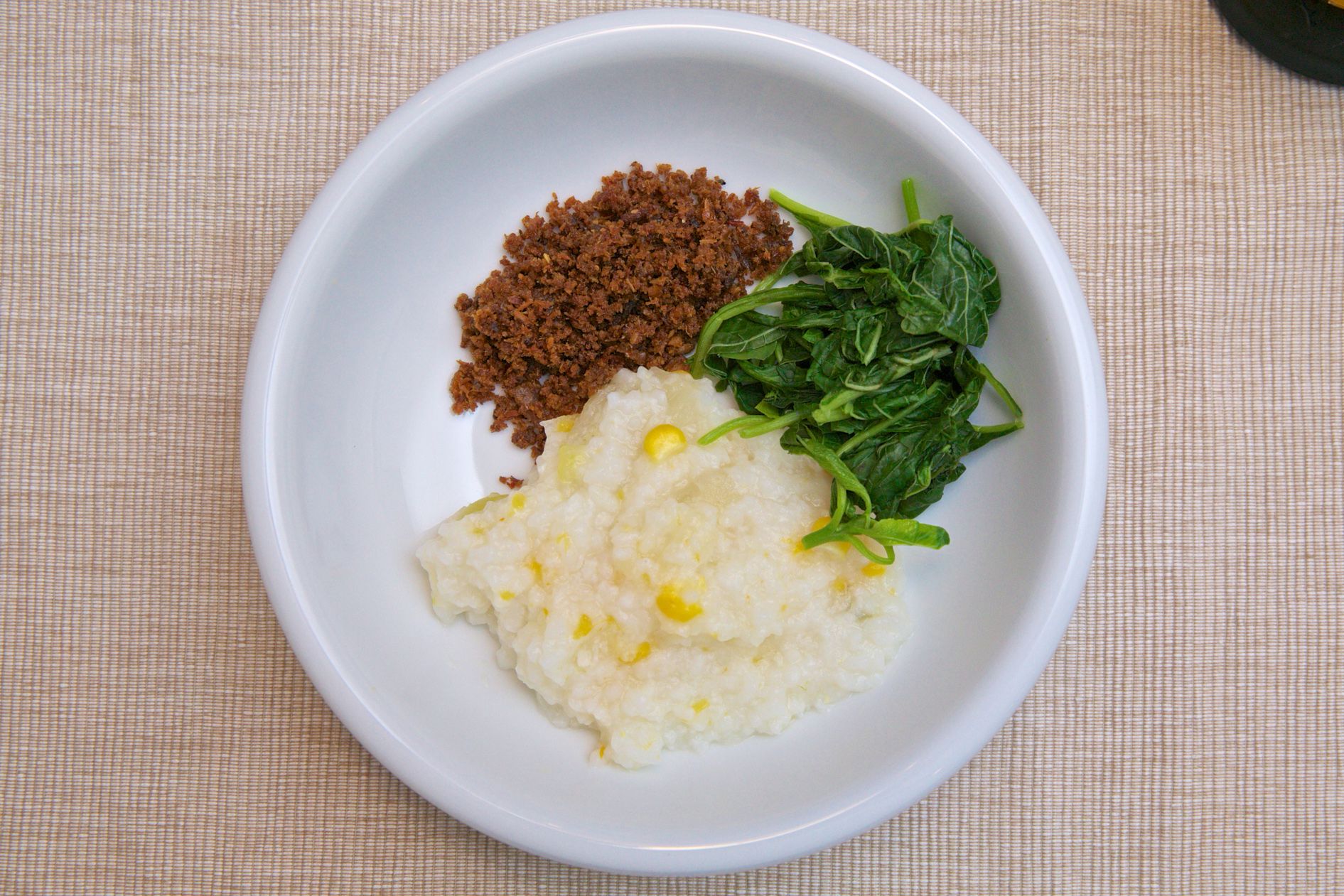 indonesian corn porridge with spinach and dried minced beef stock