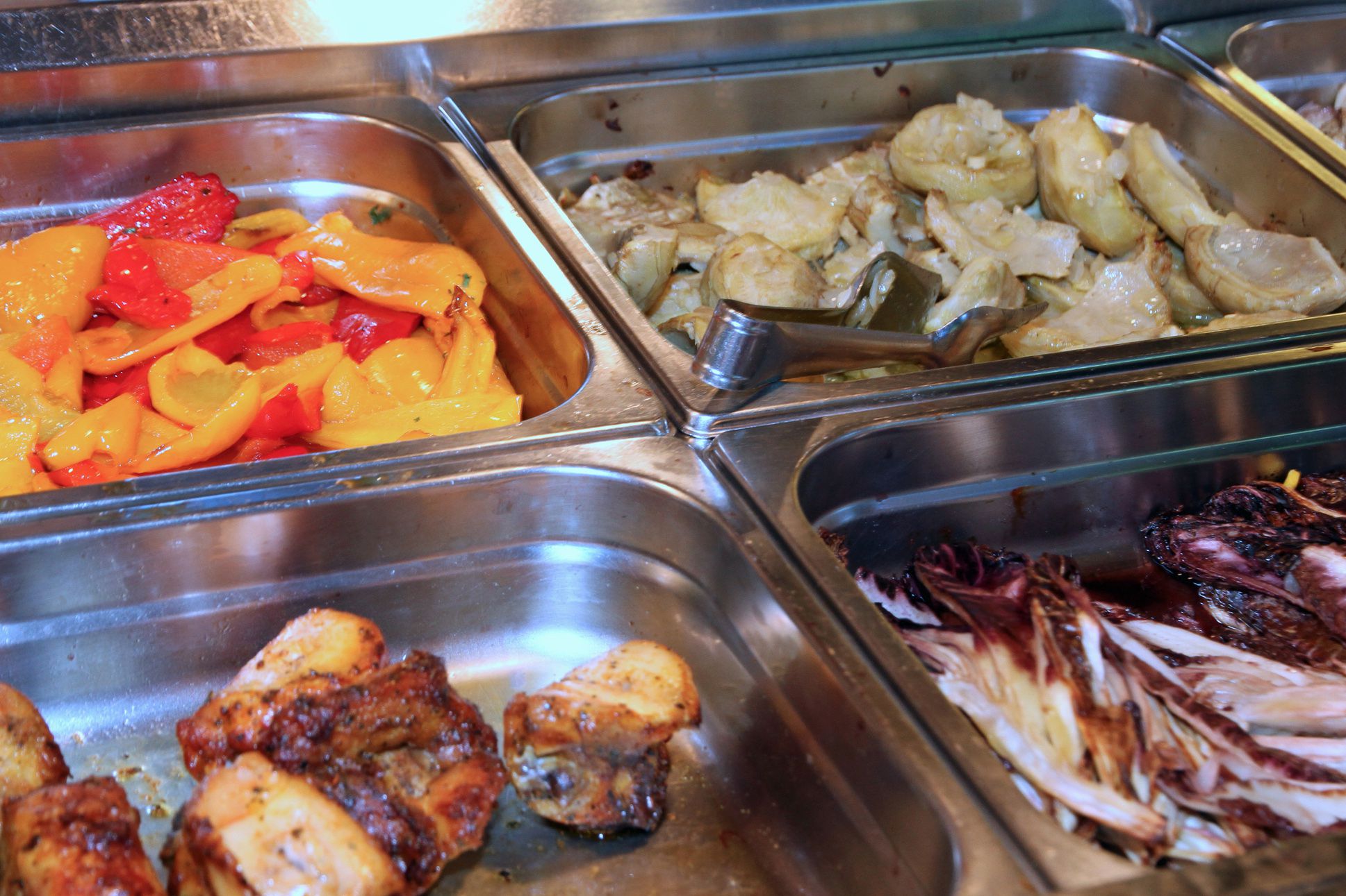 steel trays with italian vegetables and meats