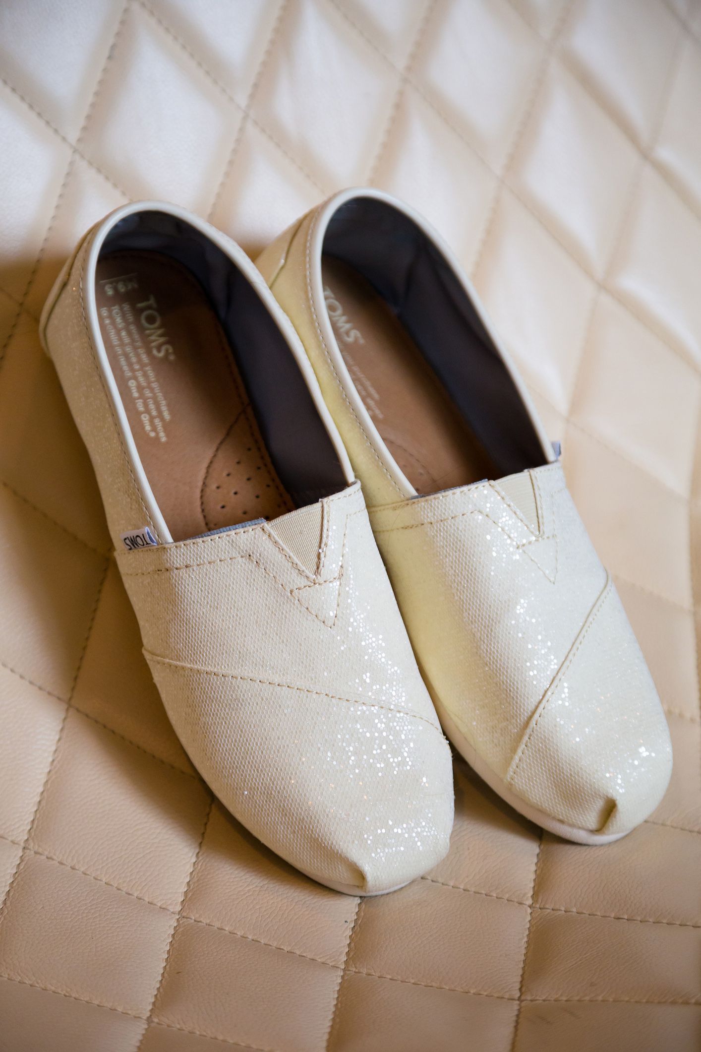 white toms on leather chair
