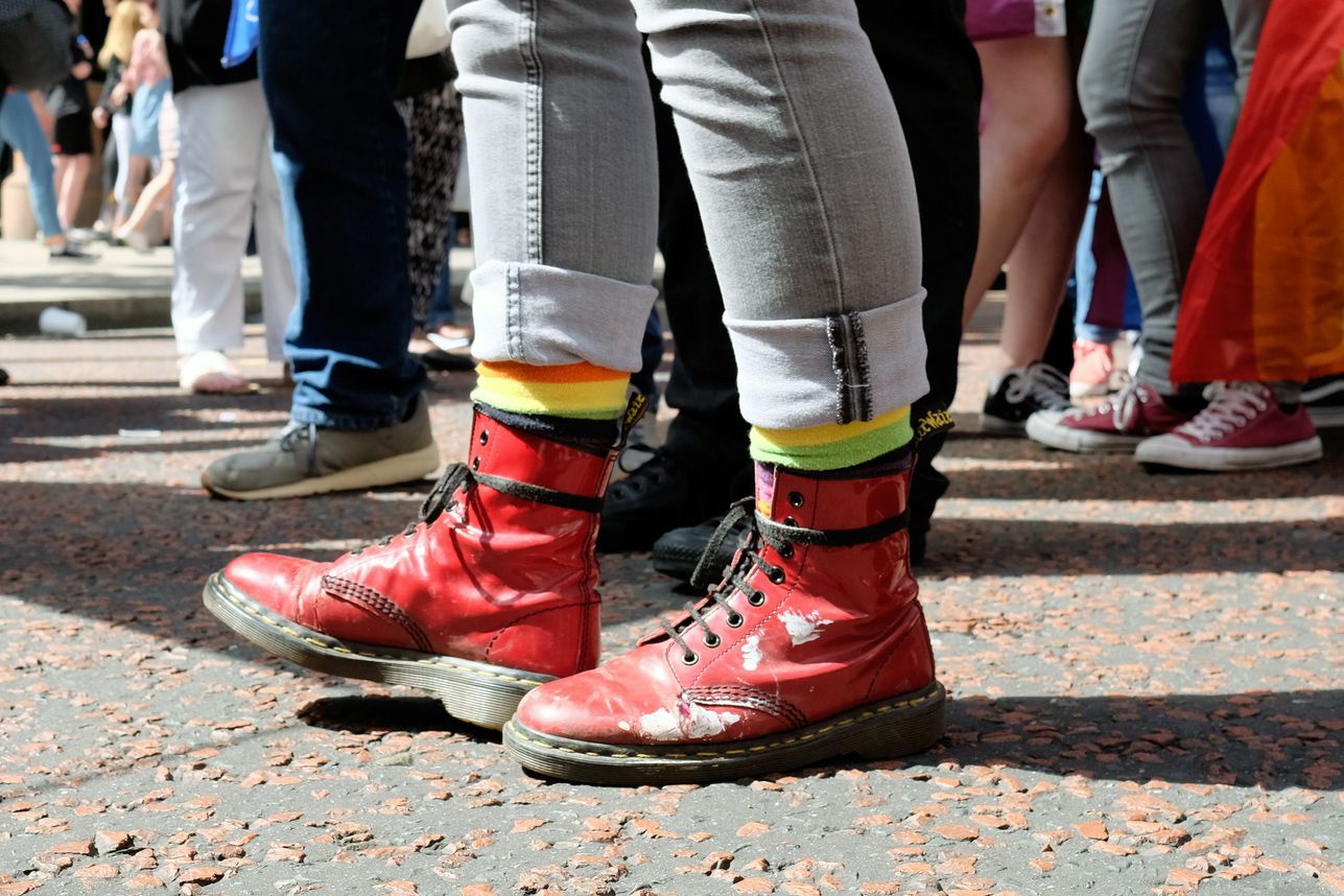 red dr martens on street during pride parade in belfast, 2017