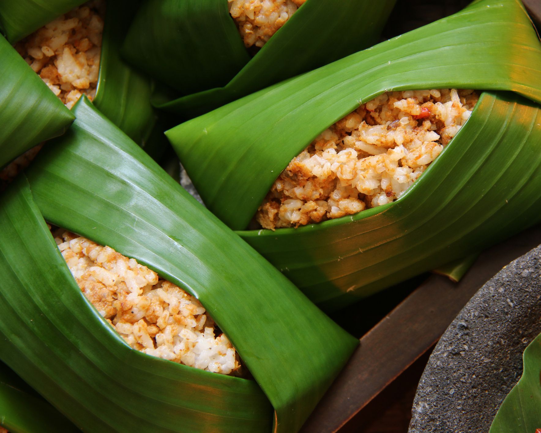 nasi tutug oncom, the sundanese dish of rice mixed with fermented soybean wrapped in banana leaves