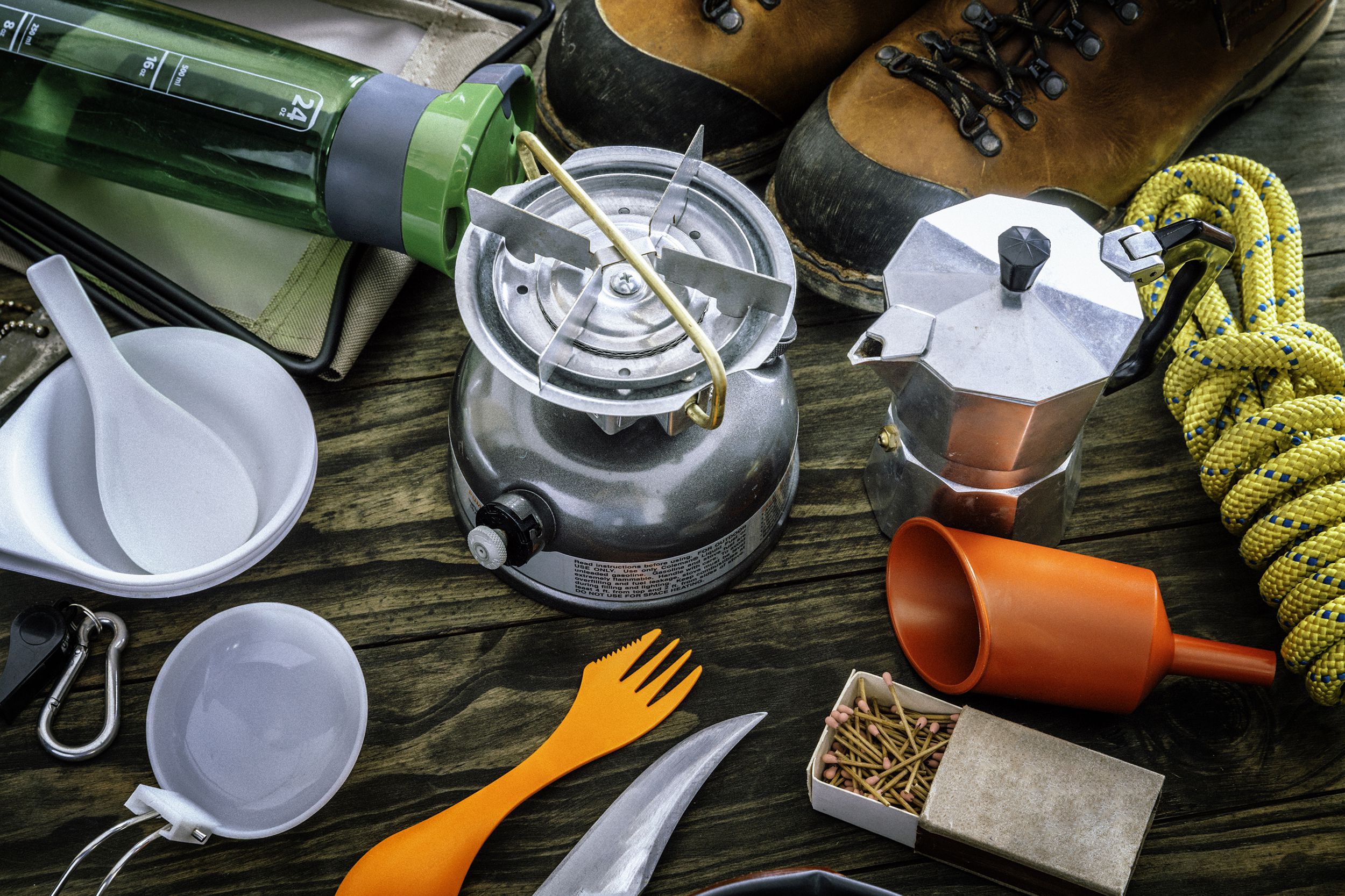 travel equipment and accessories for mountain hiking trip on wood