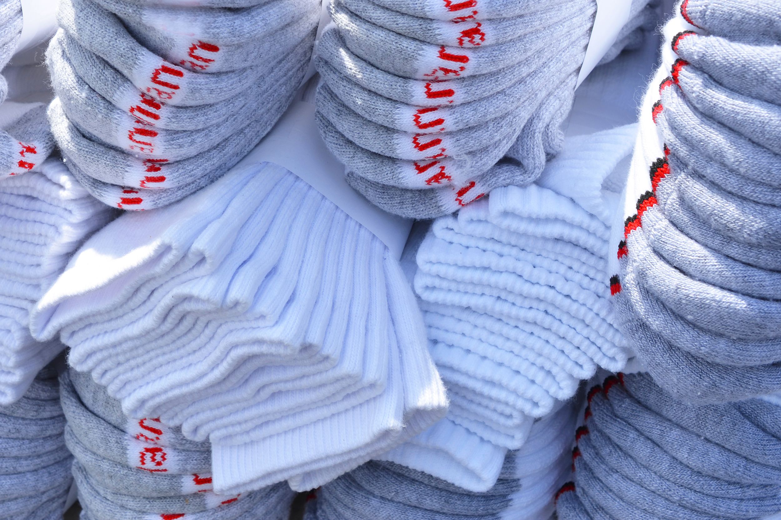 pile of white Hanes socks