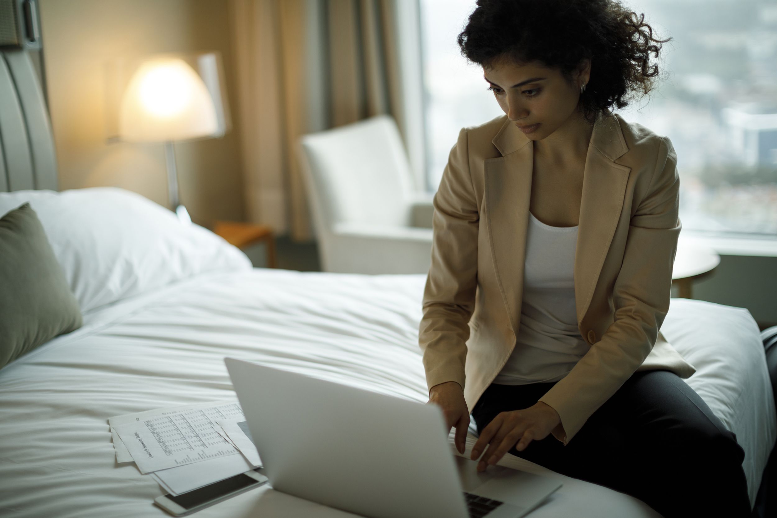 businesswoman working in a hotel room