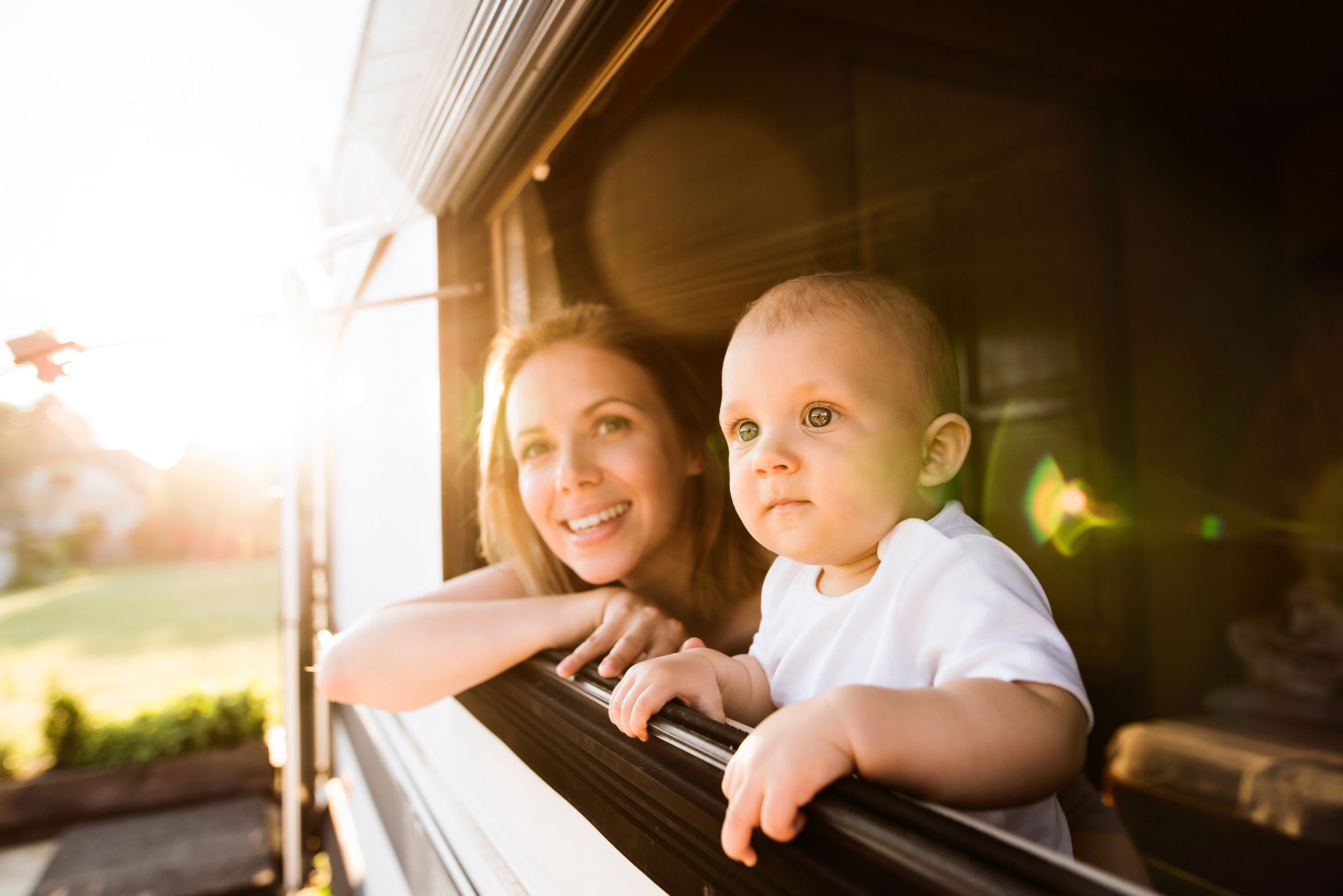 mother and baby son in a camper van