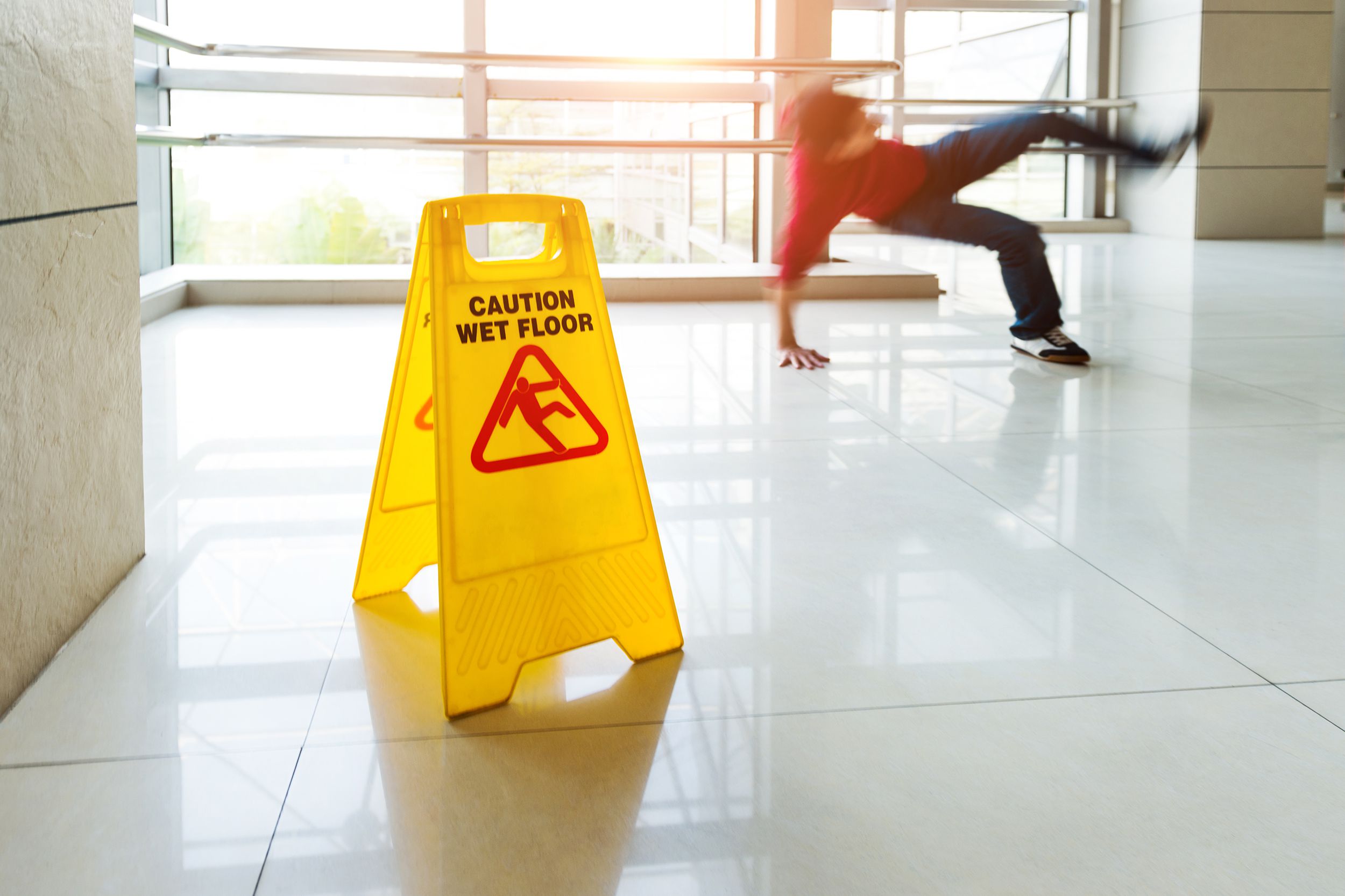 man slips falling on wet floor