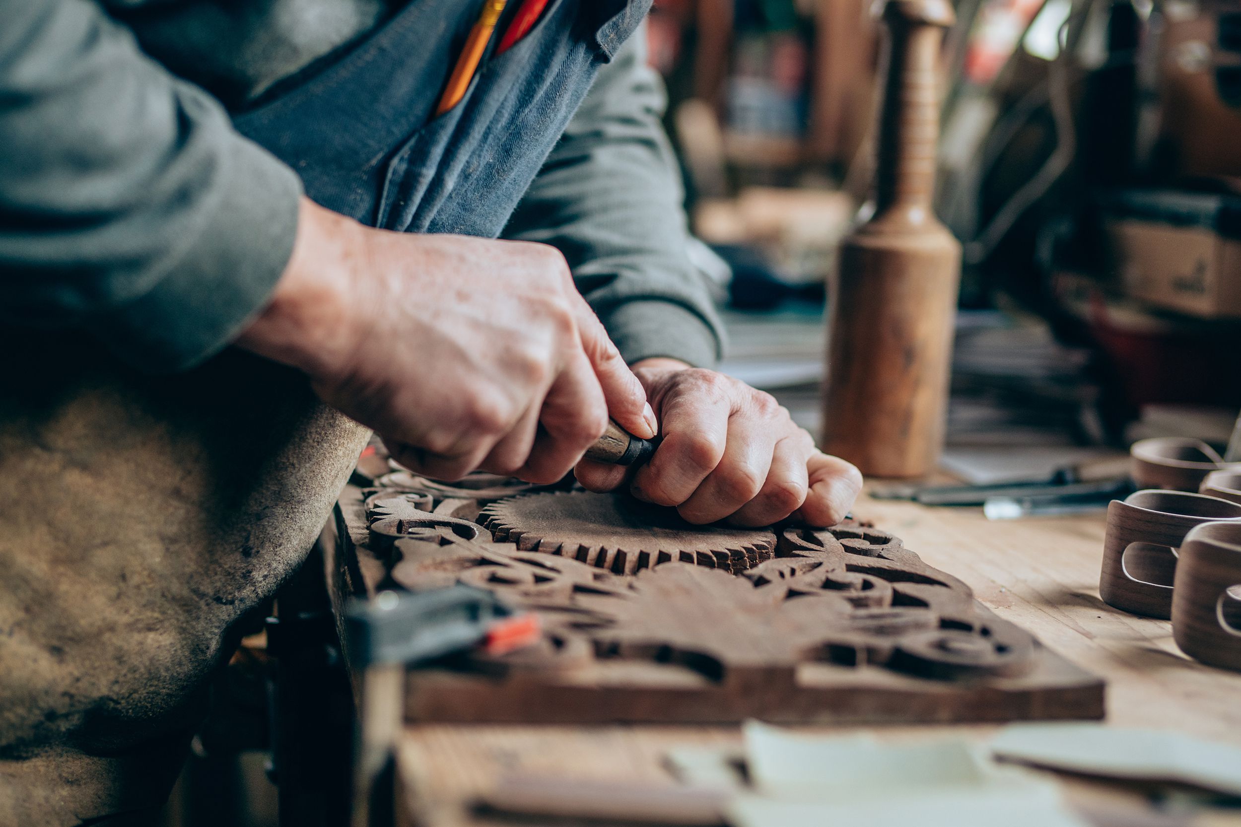 man doing intricate woodworking piece