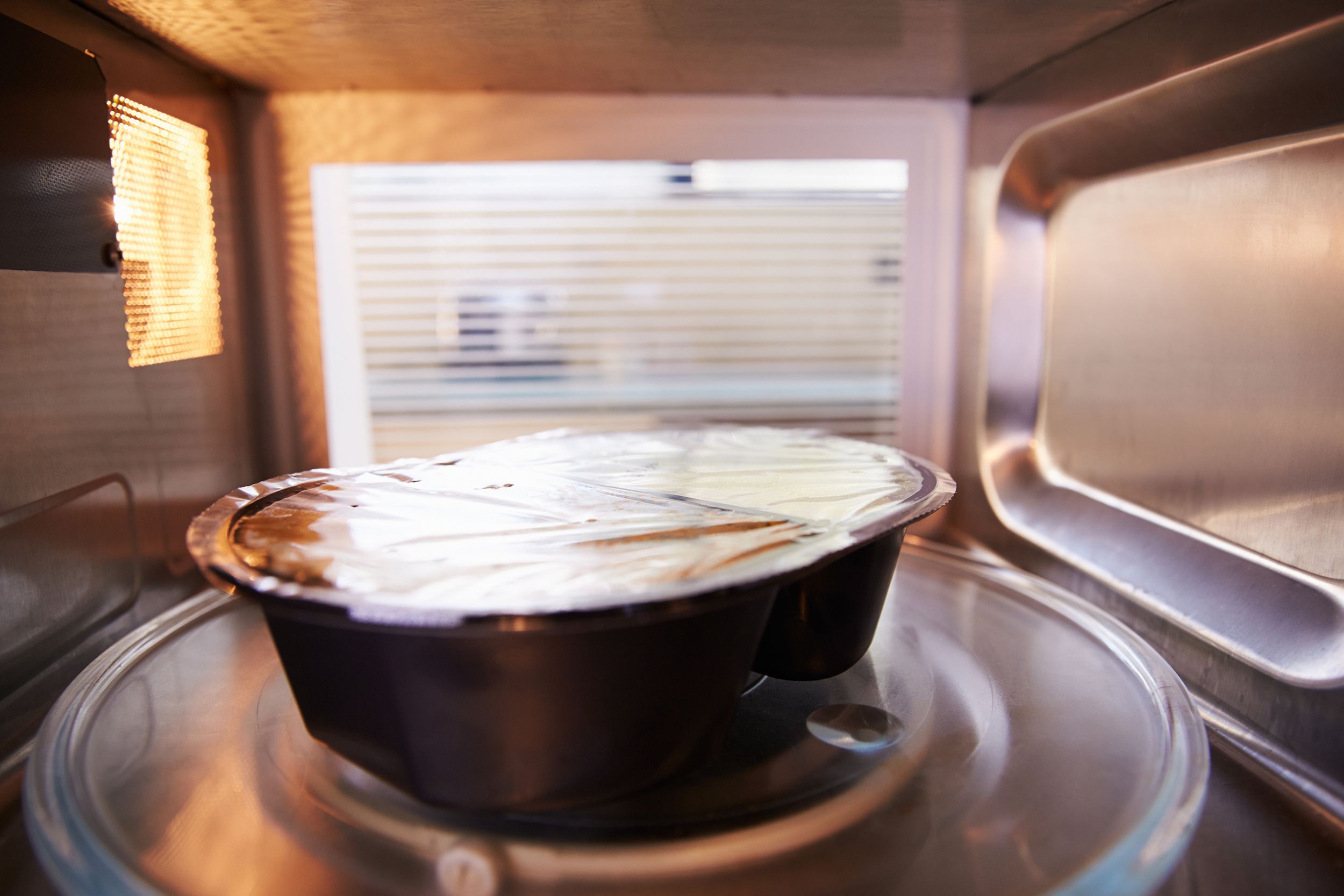 tv dinner cooking inside microwave oven
