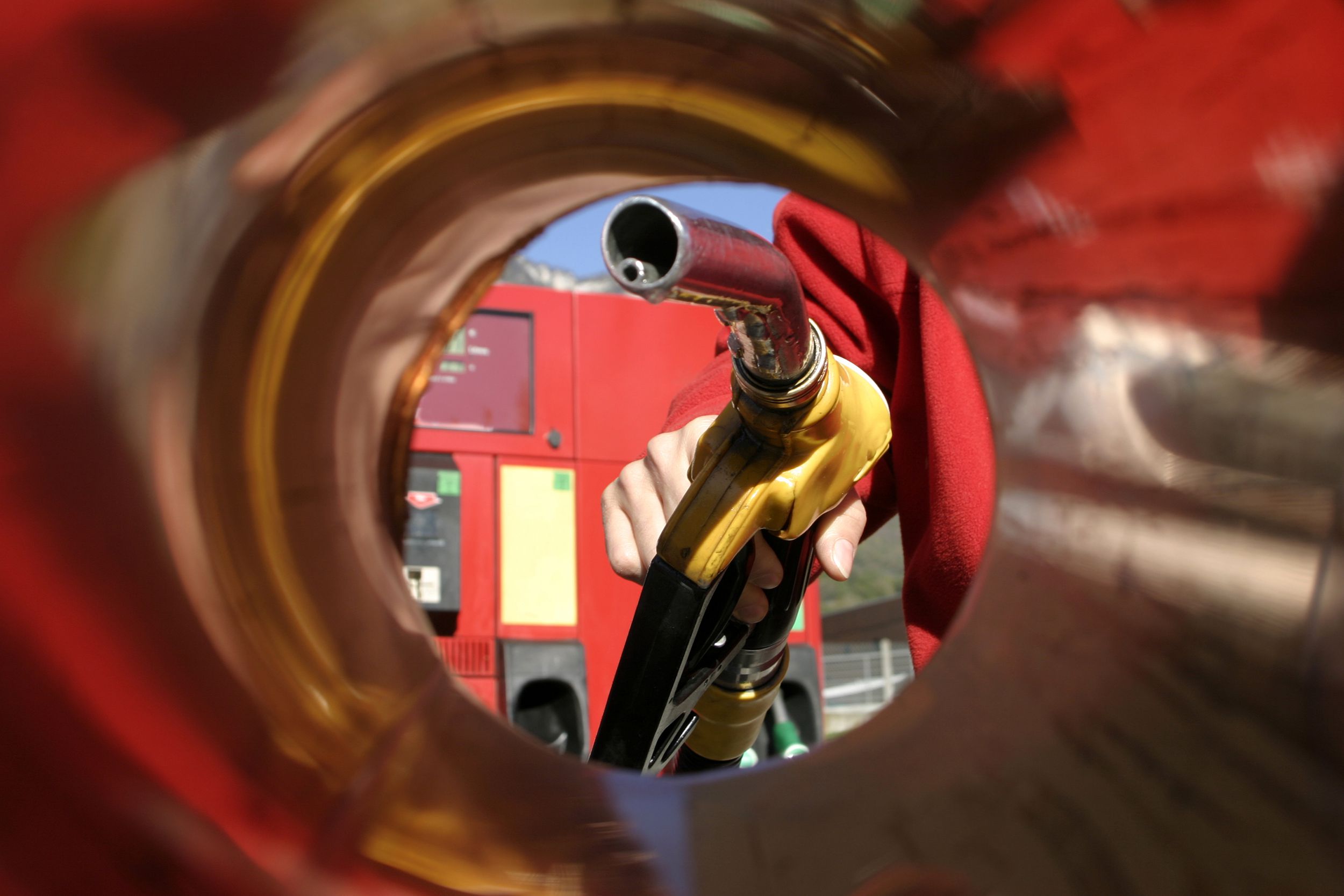 person filling up the car in a gas station