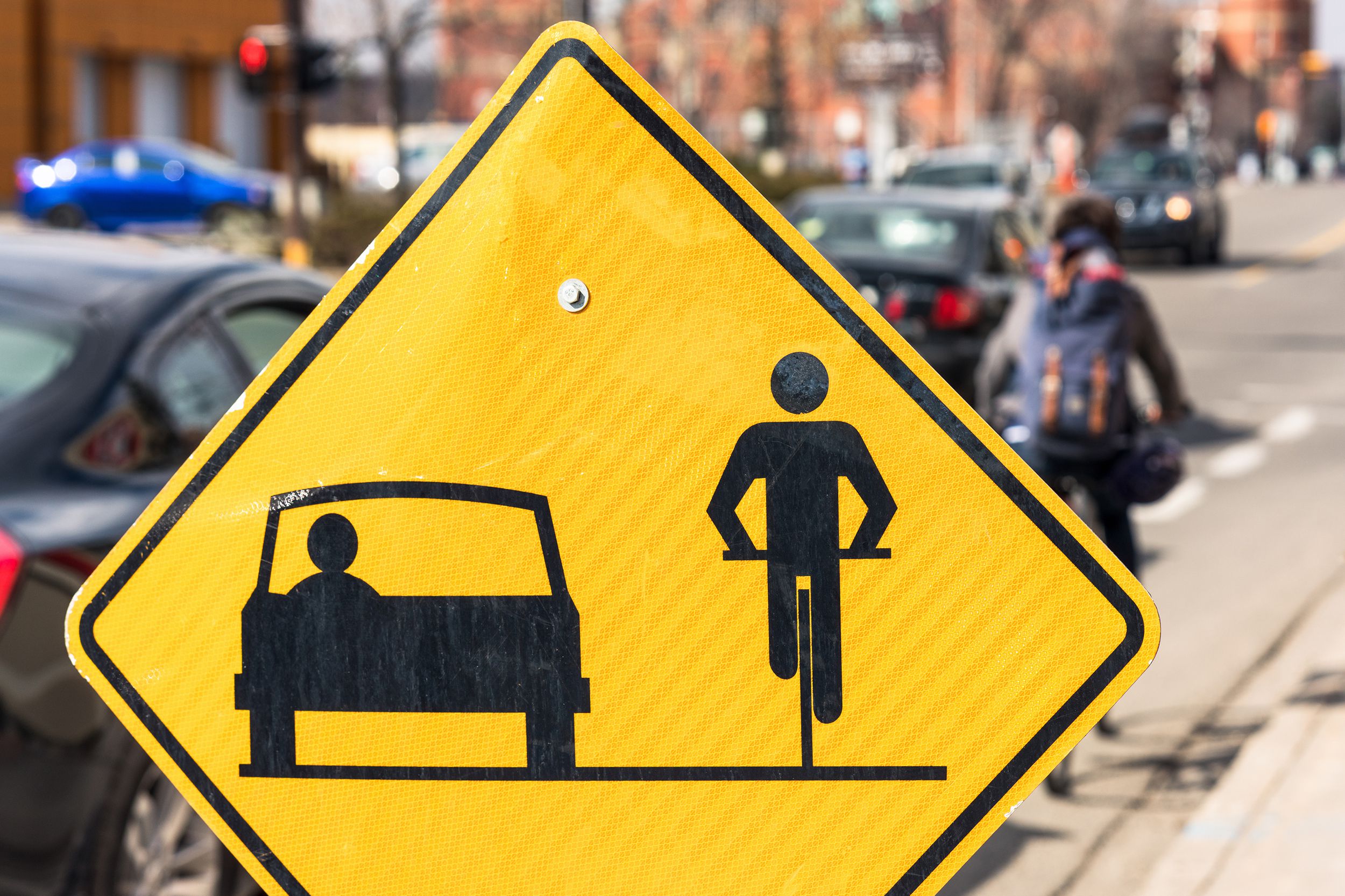 sign urging drivers and cyclists to share the road