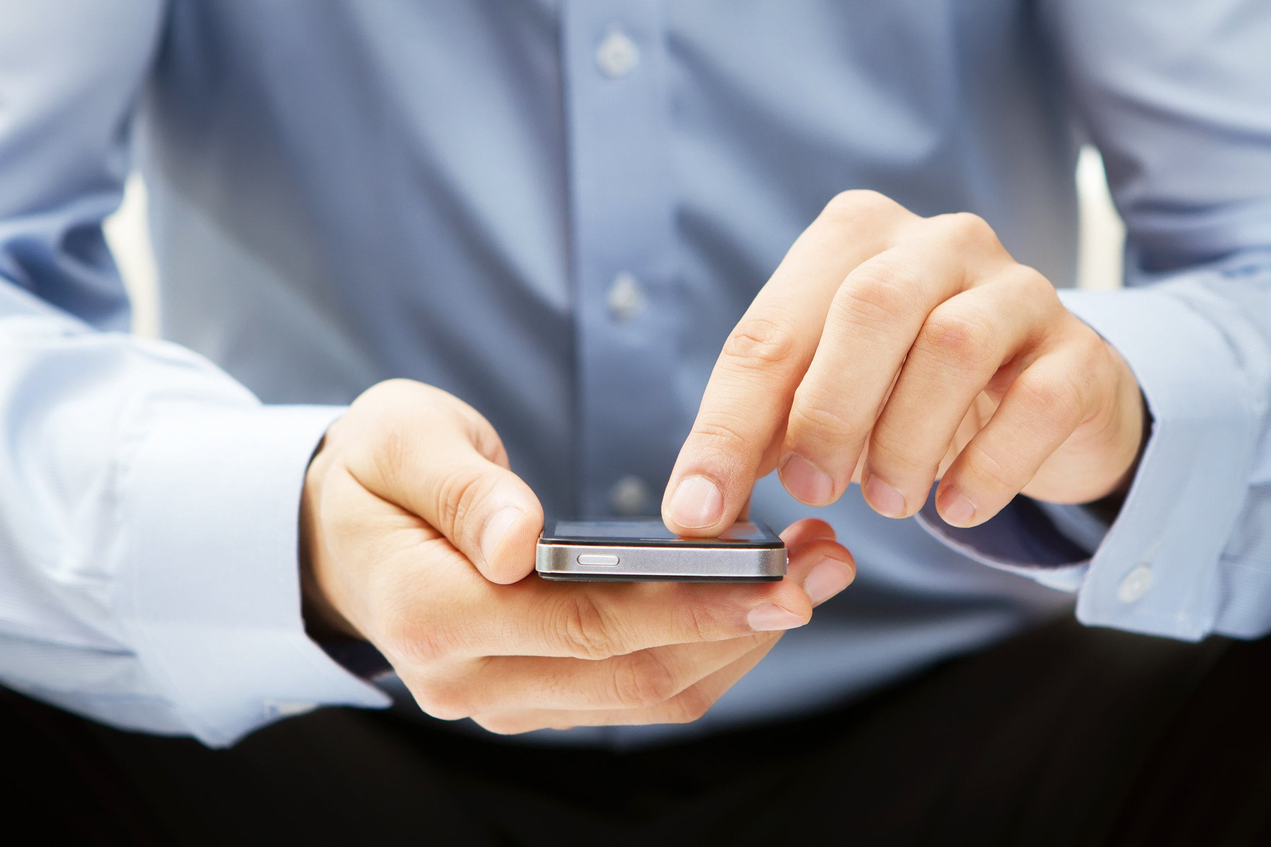 close up of a man using mobile phone