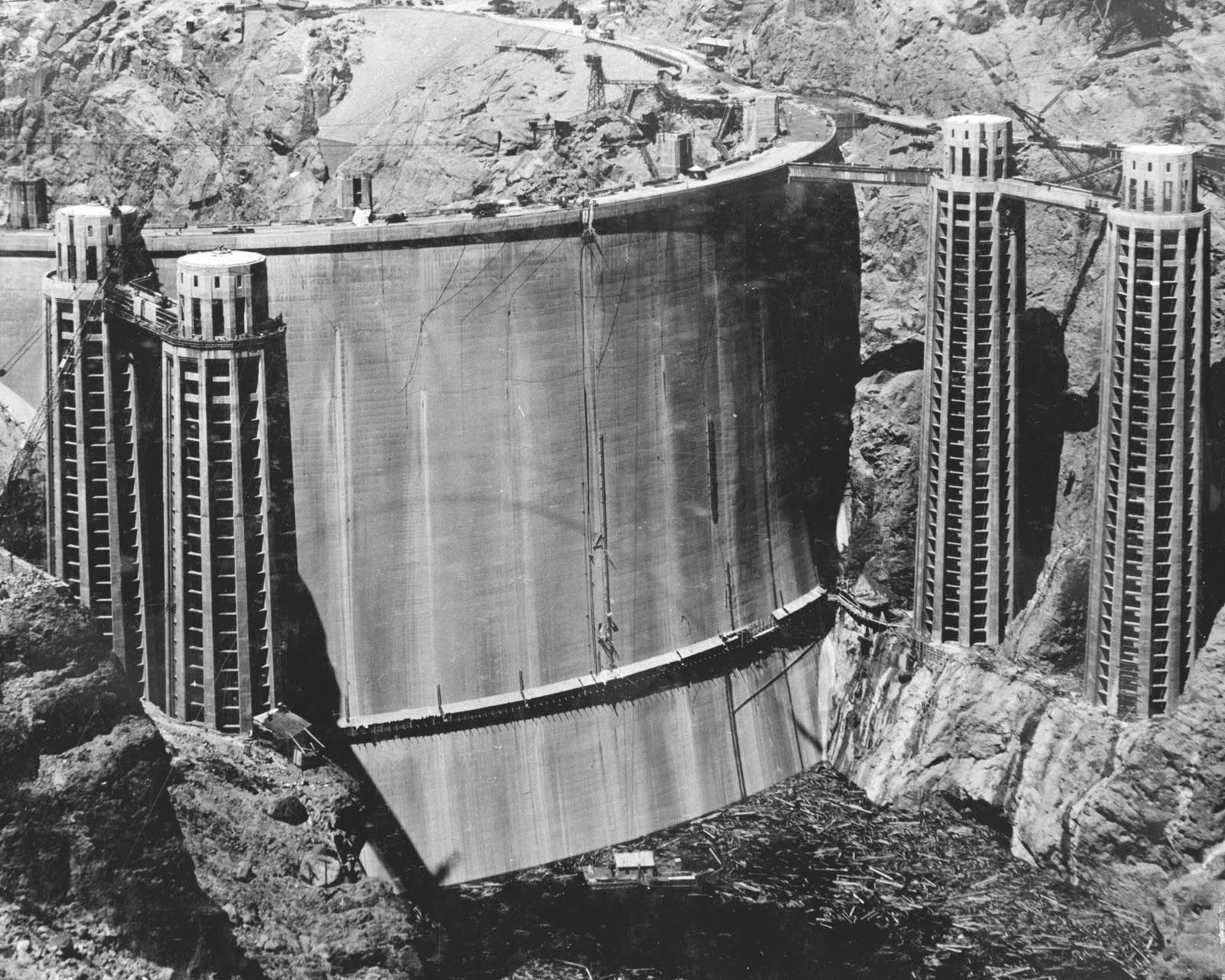 The upstream face of Hoover Dam slowly disappears as Lake Mead fills, May 1935