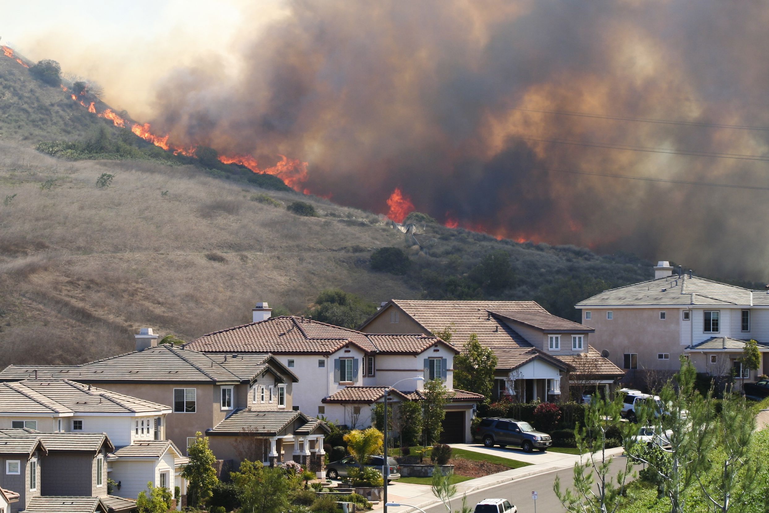 Southern California brush fire near houses
