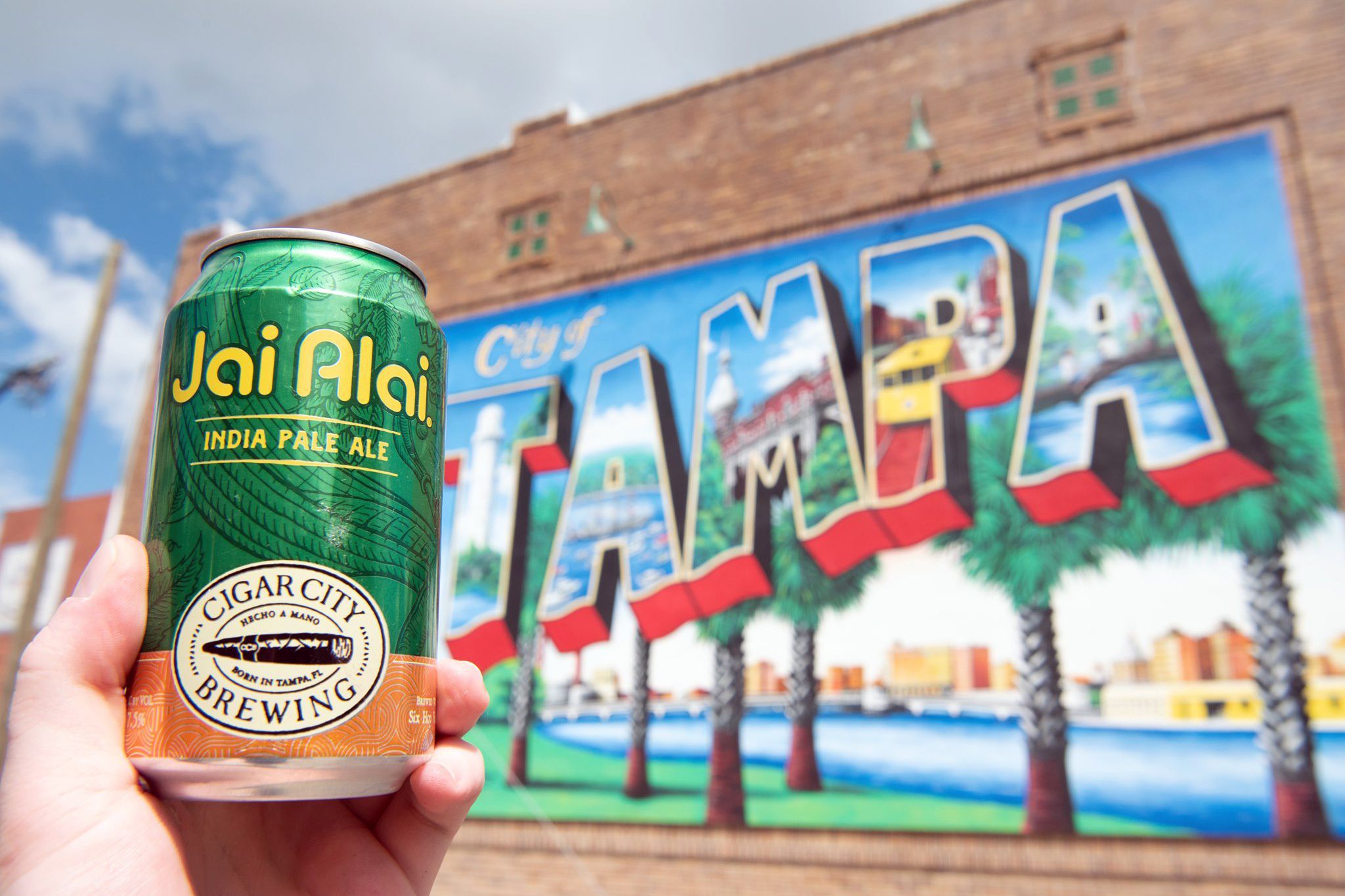 can of jai alai pale ale in front of city of Tampa sign