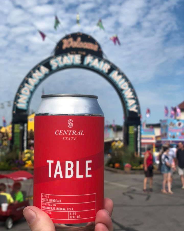 can of central state brewing beer held in front of the indiana state fair