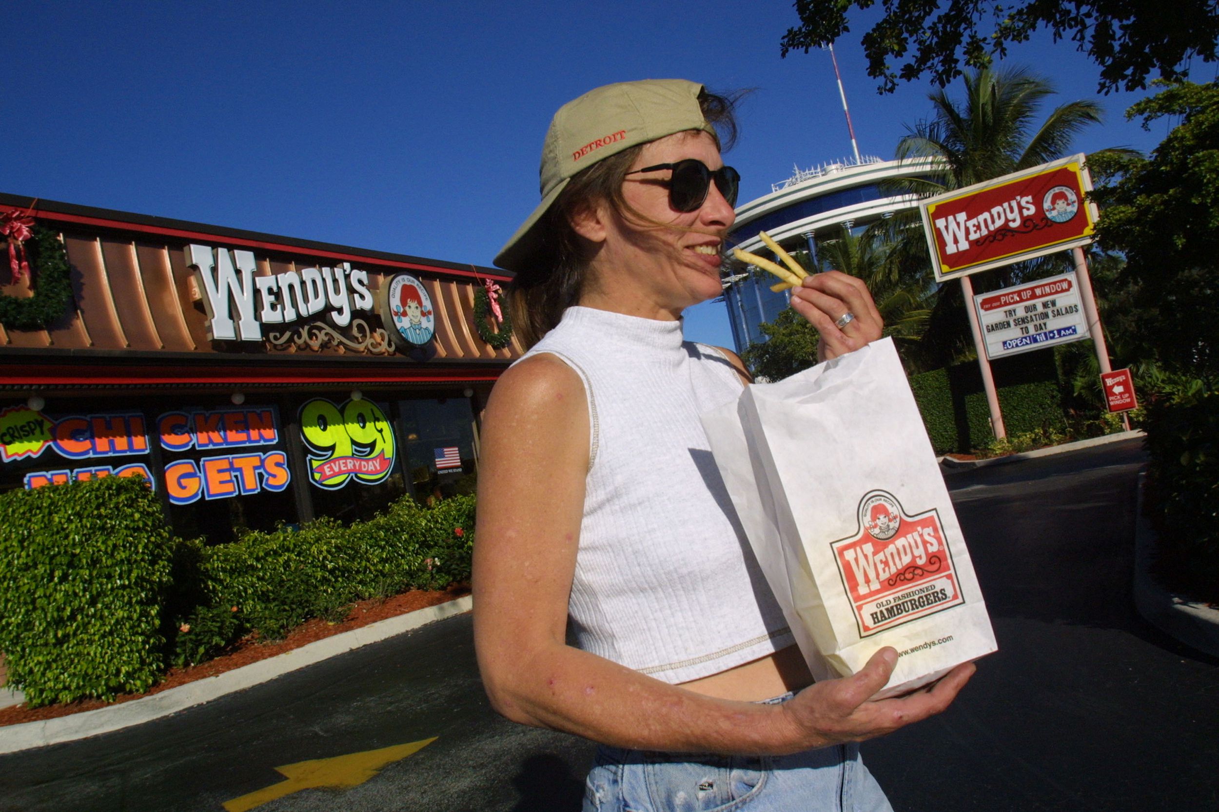 Leslie Campbell eats french fries as she leaves a Wendys restaurant January 8, 2002 in Ft. Lauderdale, Florida.