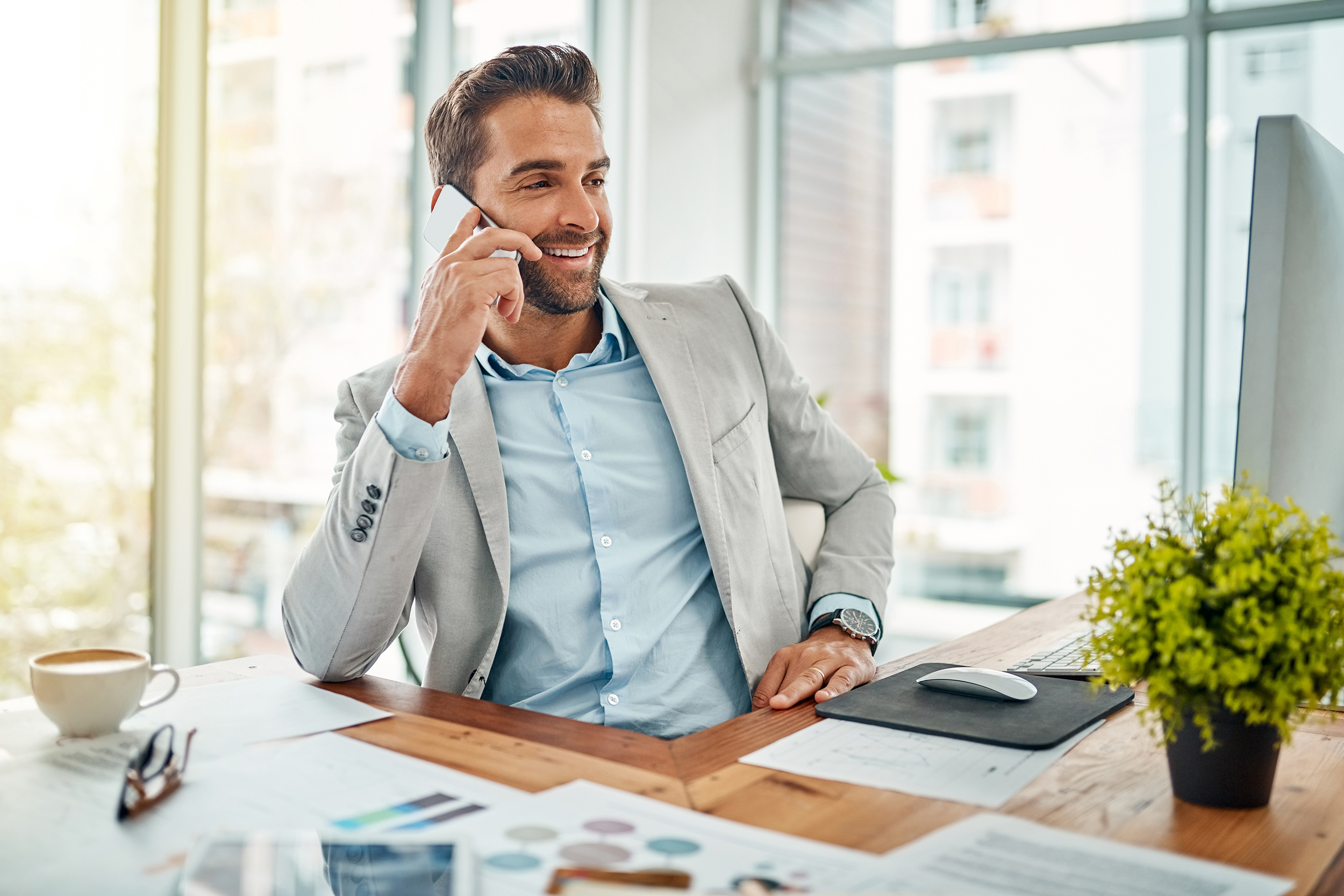 Man in the office talking on his phone