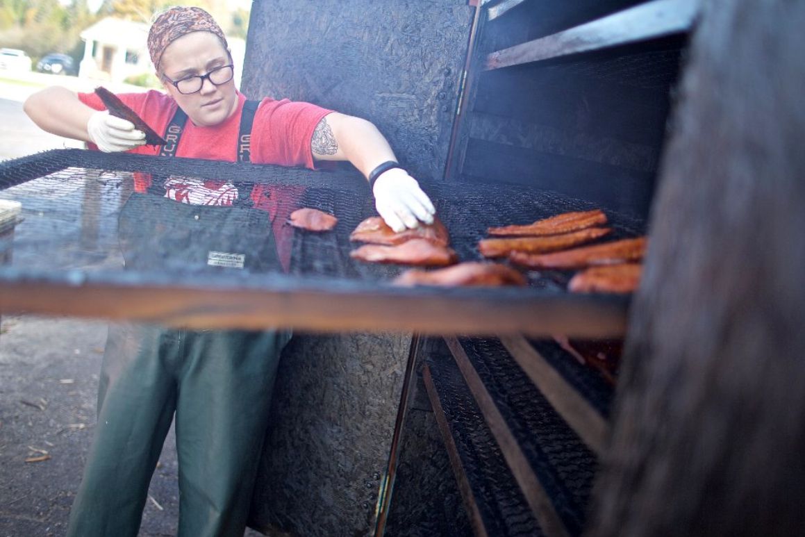 Woman smoking meat